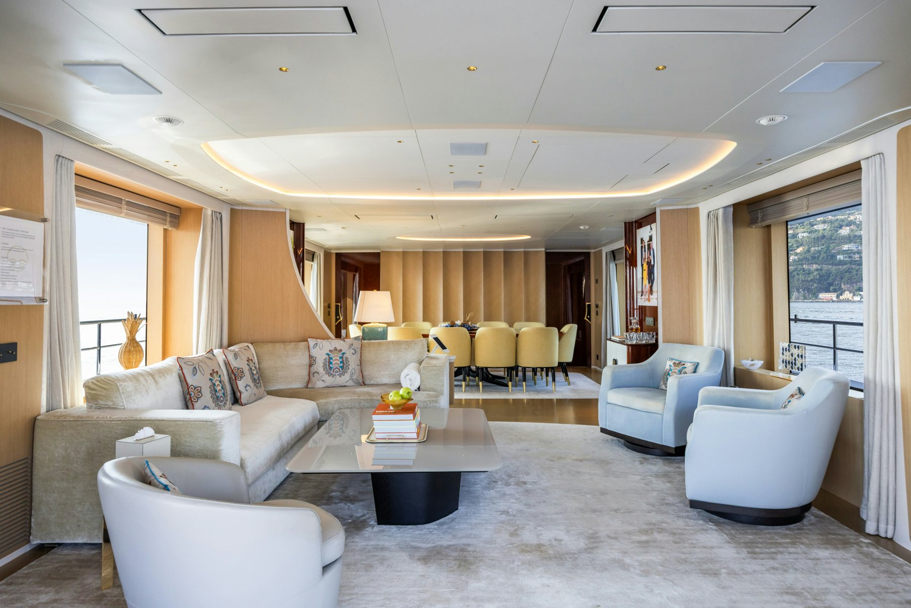 a living room with a couch and a table aboard BELLA VITA Yacht for Sale