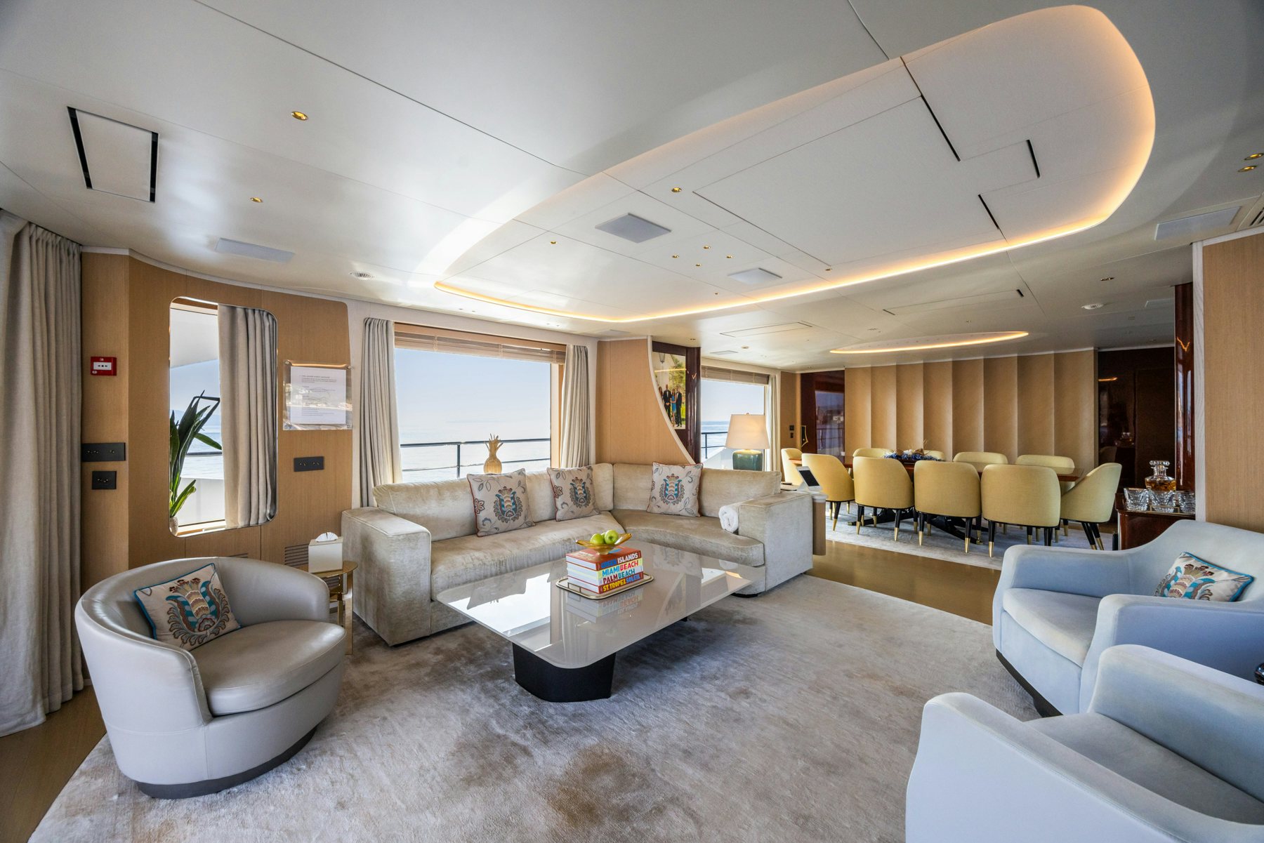 a living room with a couch and a table aboard BELLA VITA Yacht for Sale