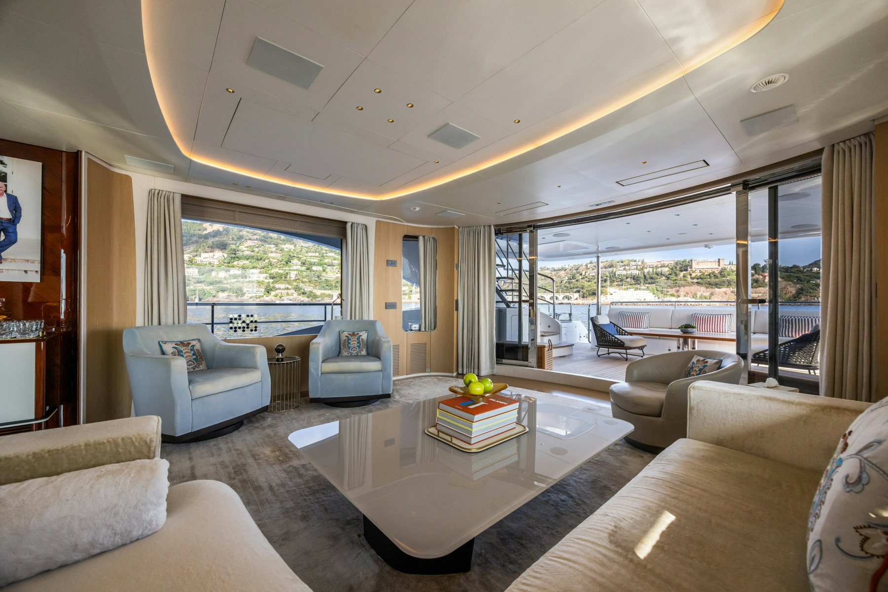 a living room with a large window aboard BELLA VITA Yacht for Sale