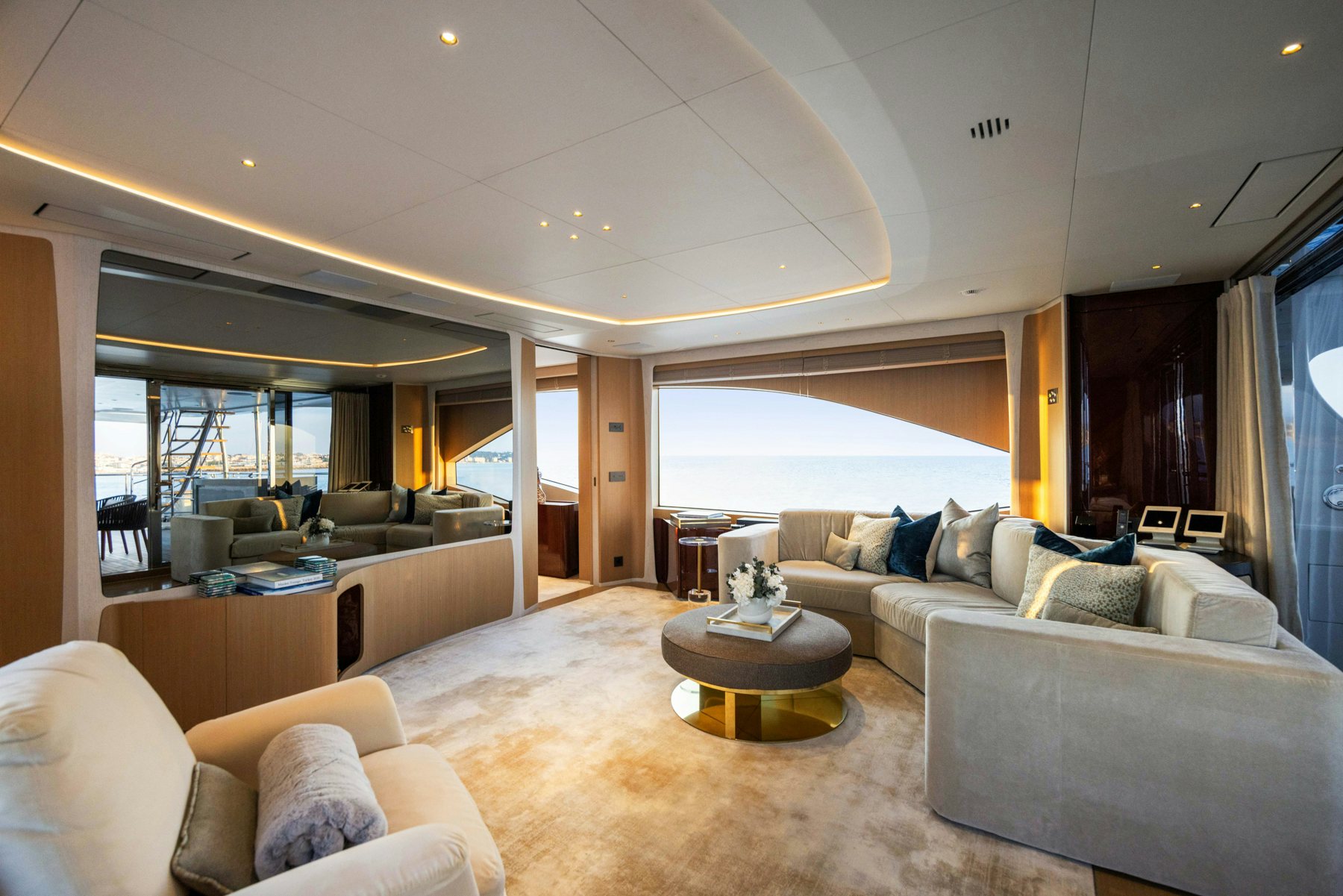 a living room with a couch and a table aboard BELLA VITA Yacht for Sale