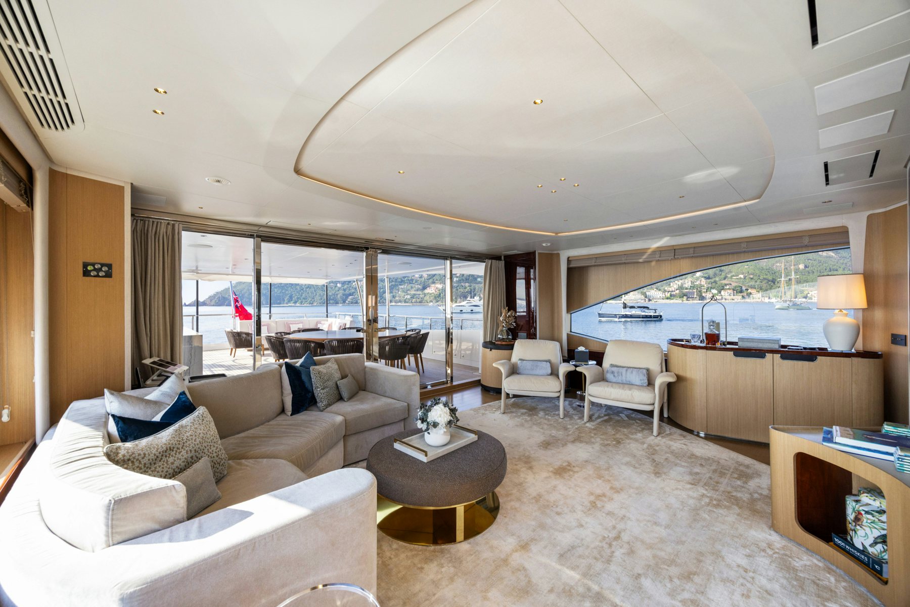 a living room with a large window aboard BELLA VITA Yacht for Sale