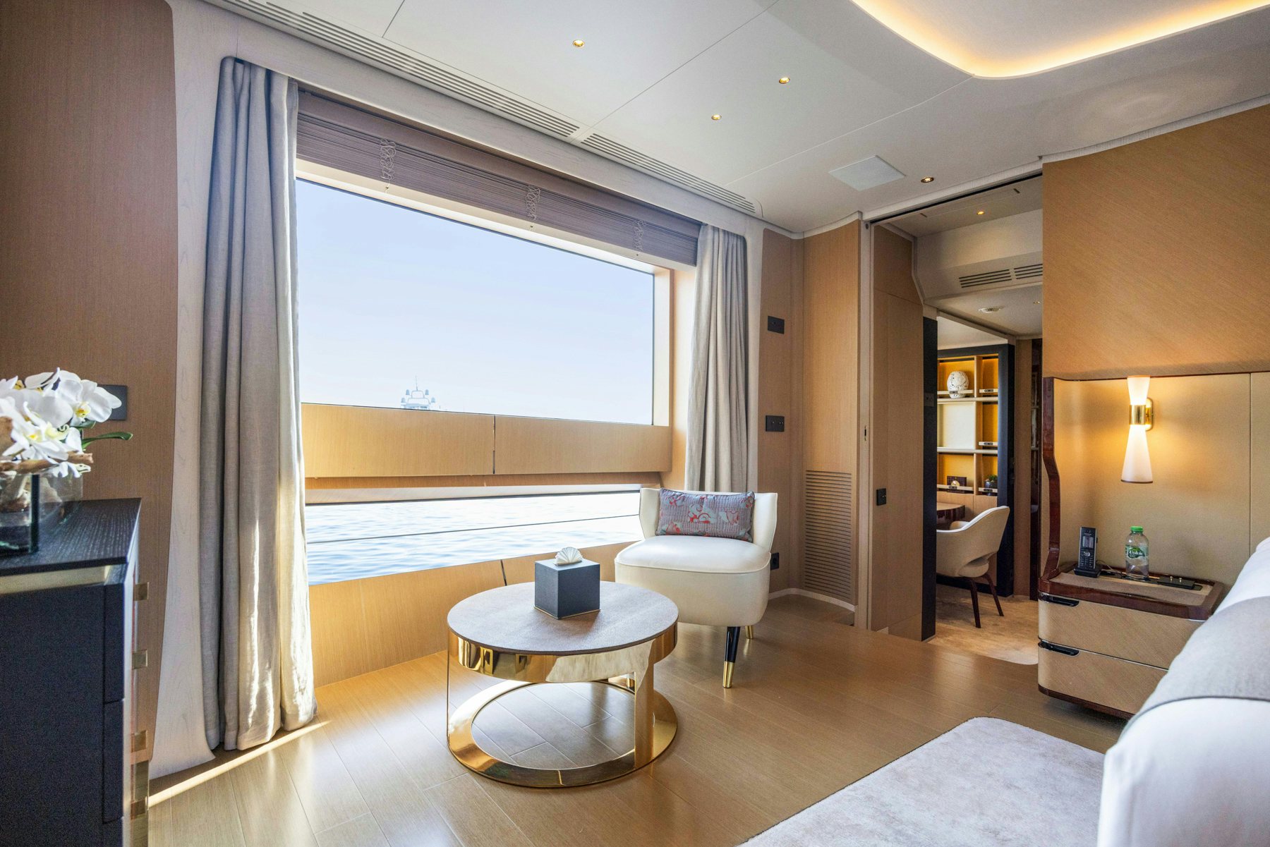 a living room with a large window aboard BELLA VITA Yacht for Sale