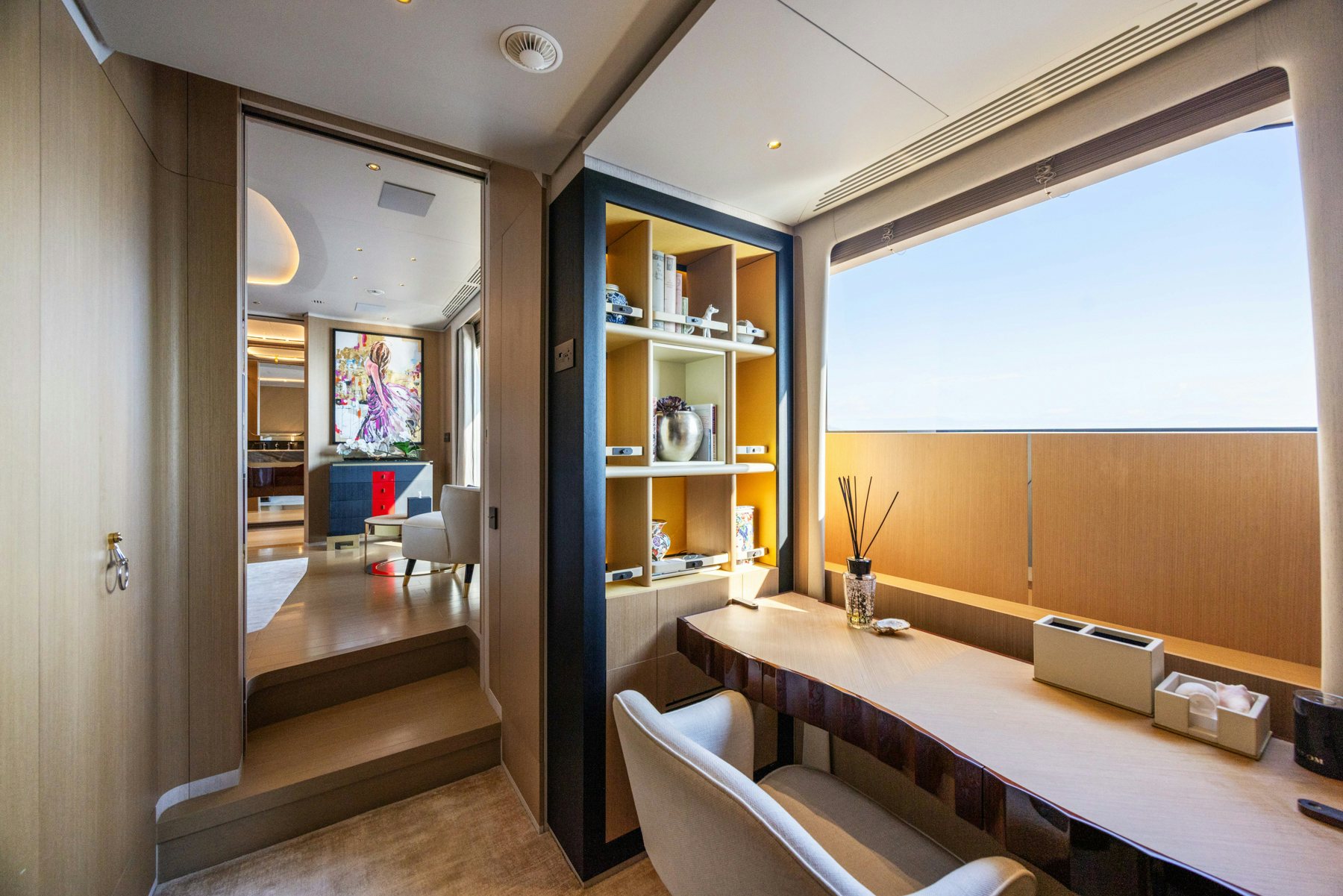 a room with a desk and a window aboard BELLA VITA Yacht for Sale