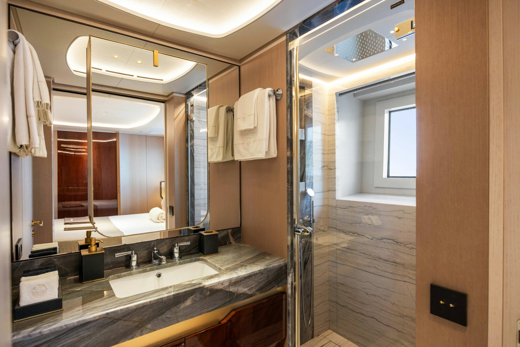 a bathroom with a large mirror aboard BELLA VITA Yacht for Sale