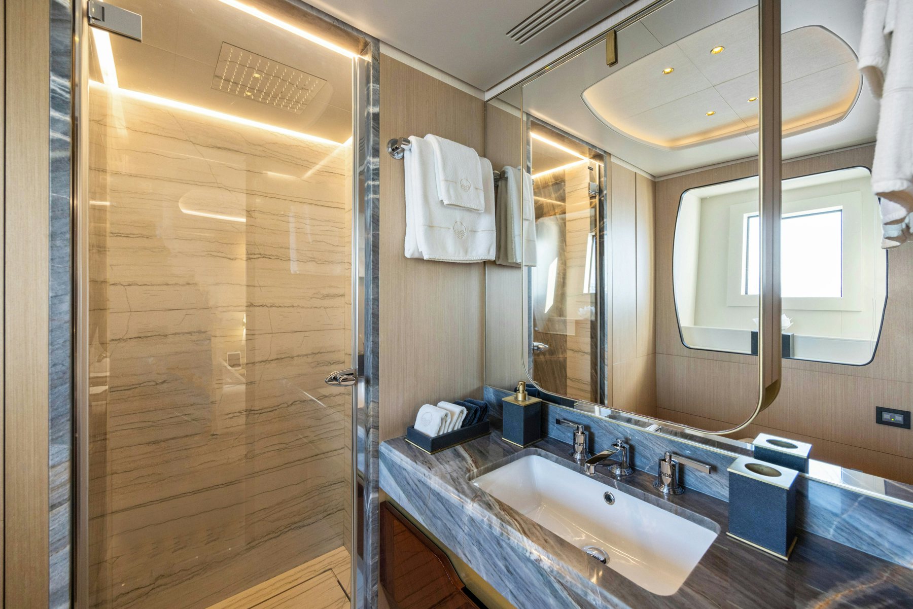 a bathroom with a large mirror aboard BELLA VITA Yacht for Sale
