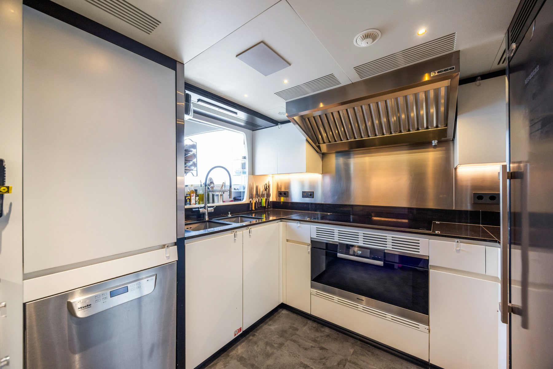a kitchen with stainless steel appliances aboard BELLA VITA Yacht for Sale