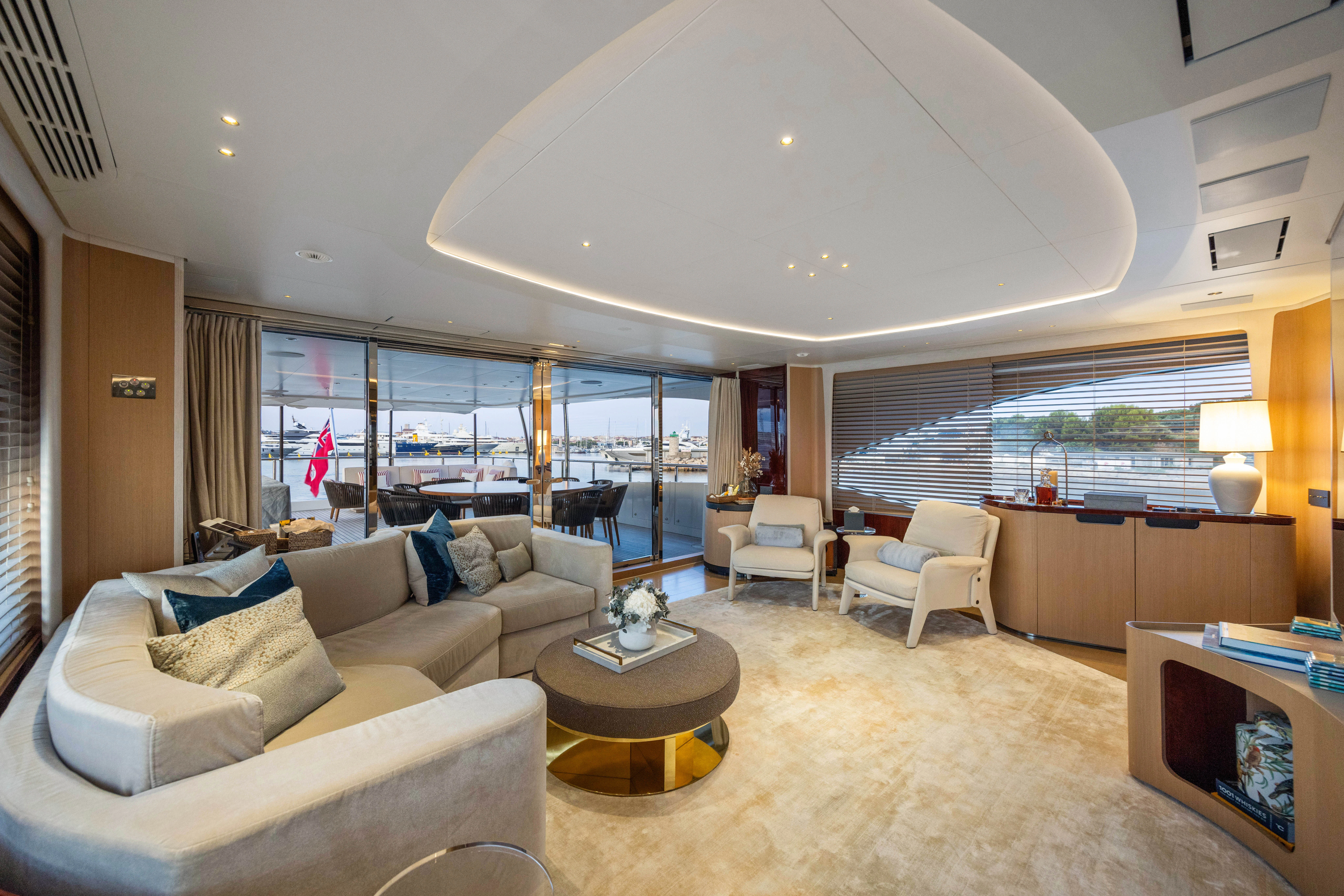 a living room with a large window aboard TRAMONTO Yacht for Charter