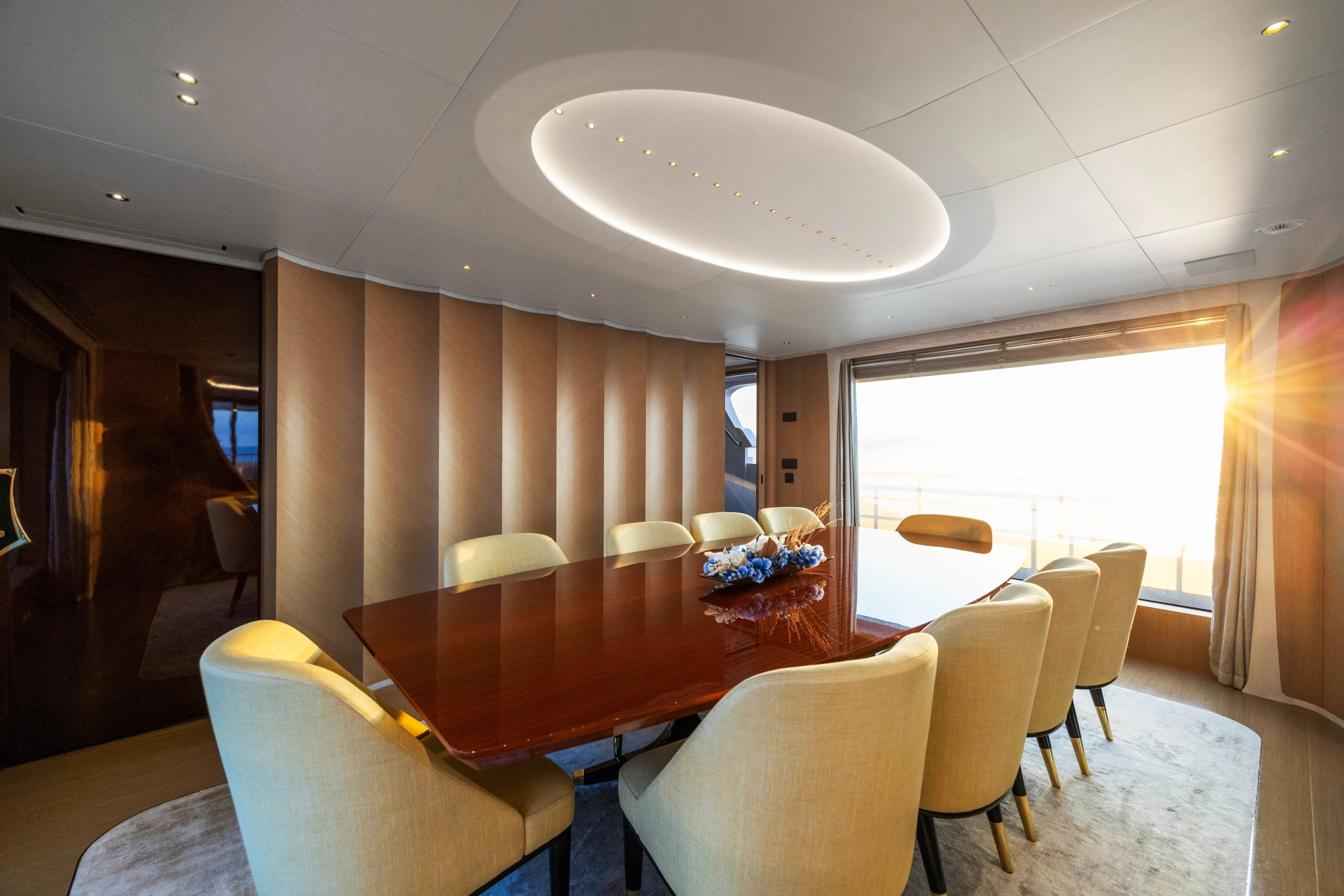 a dining room with a table and chairs aboard TRAMONTO Yacht for Charter