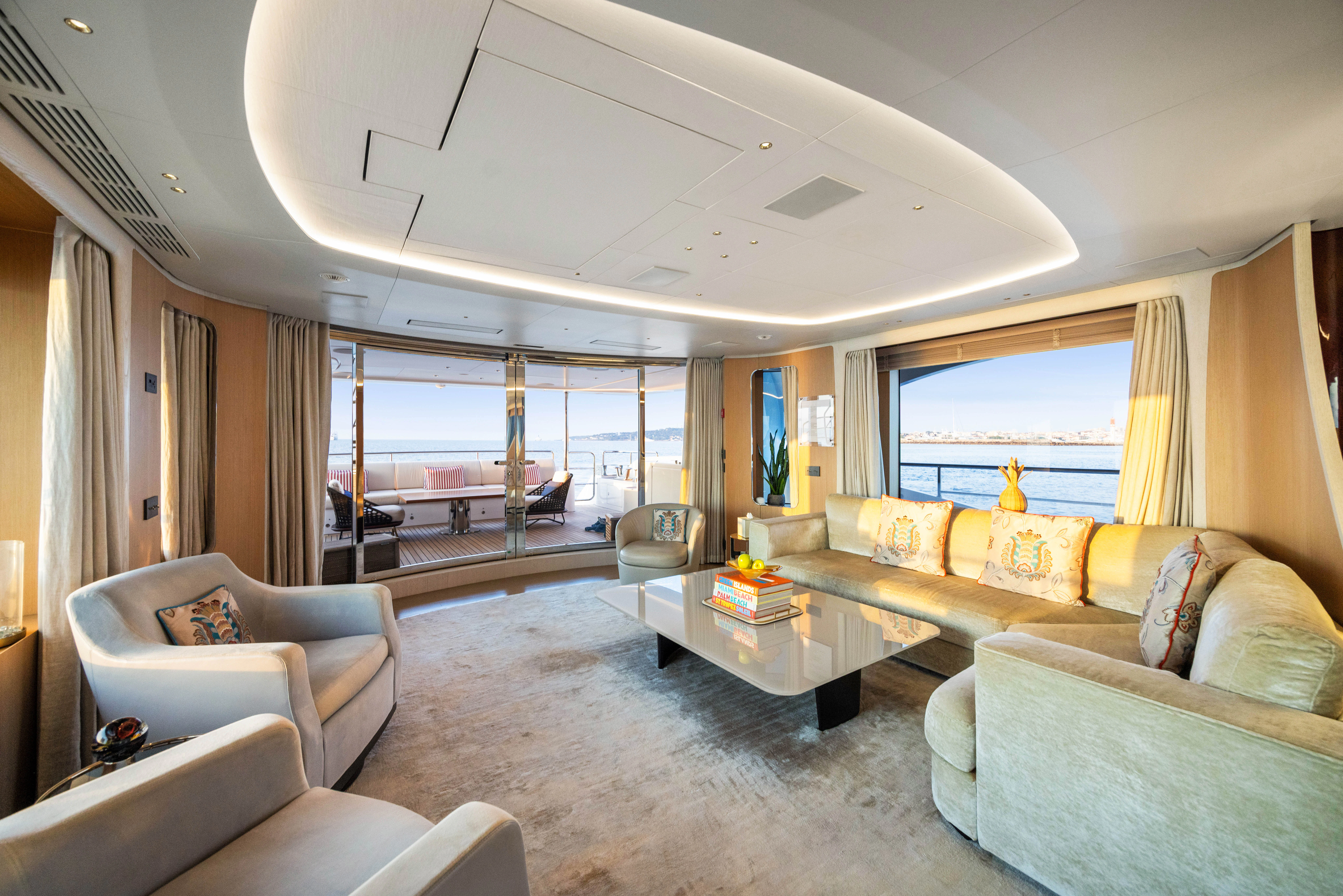 a living room with a large window aboard TRAMONTO Yacht for Charter