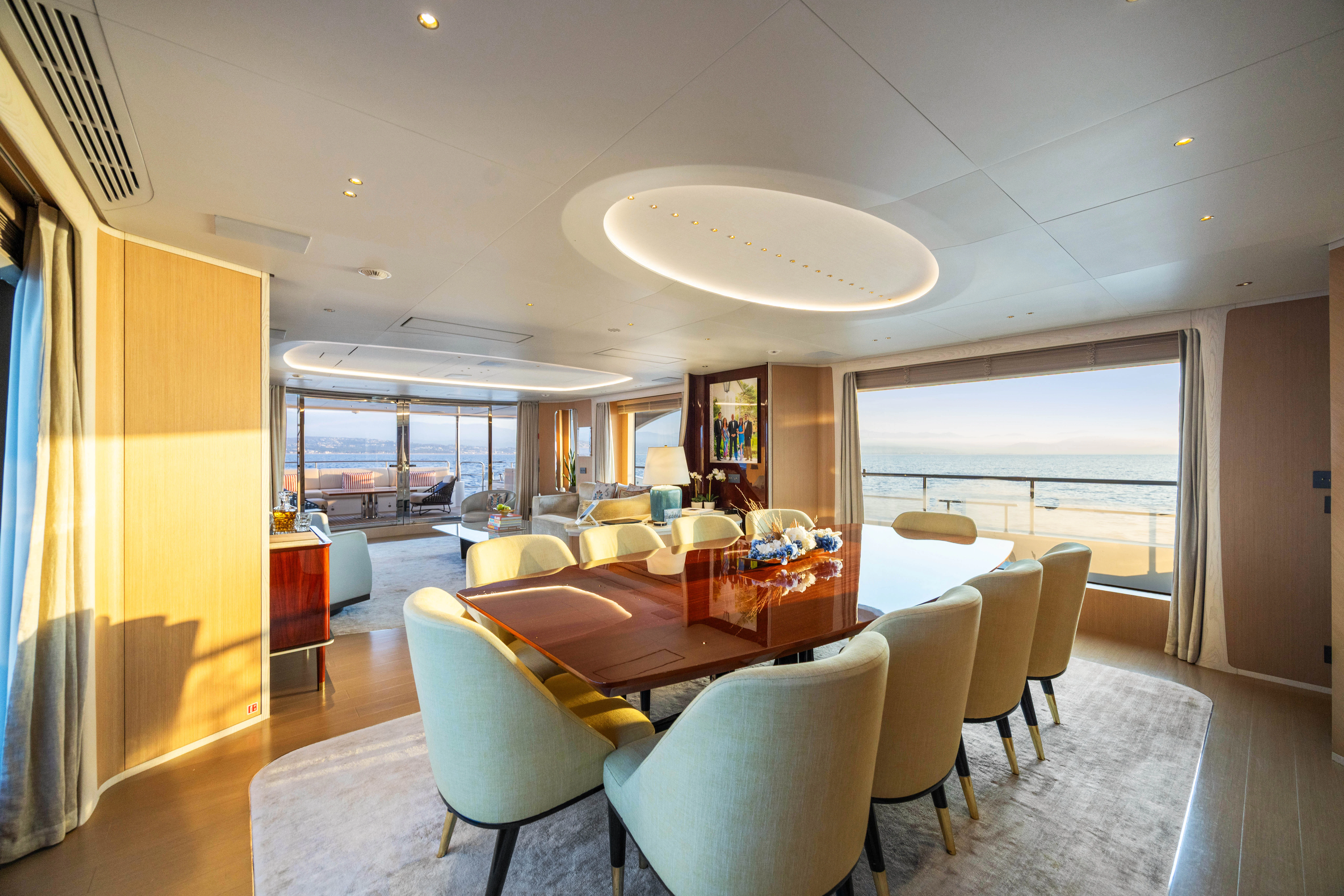 a large room with tables and chairs aboard TRAMONTO Yacht for Charter