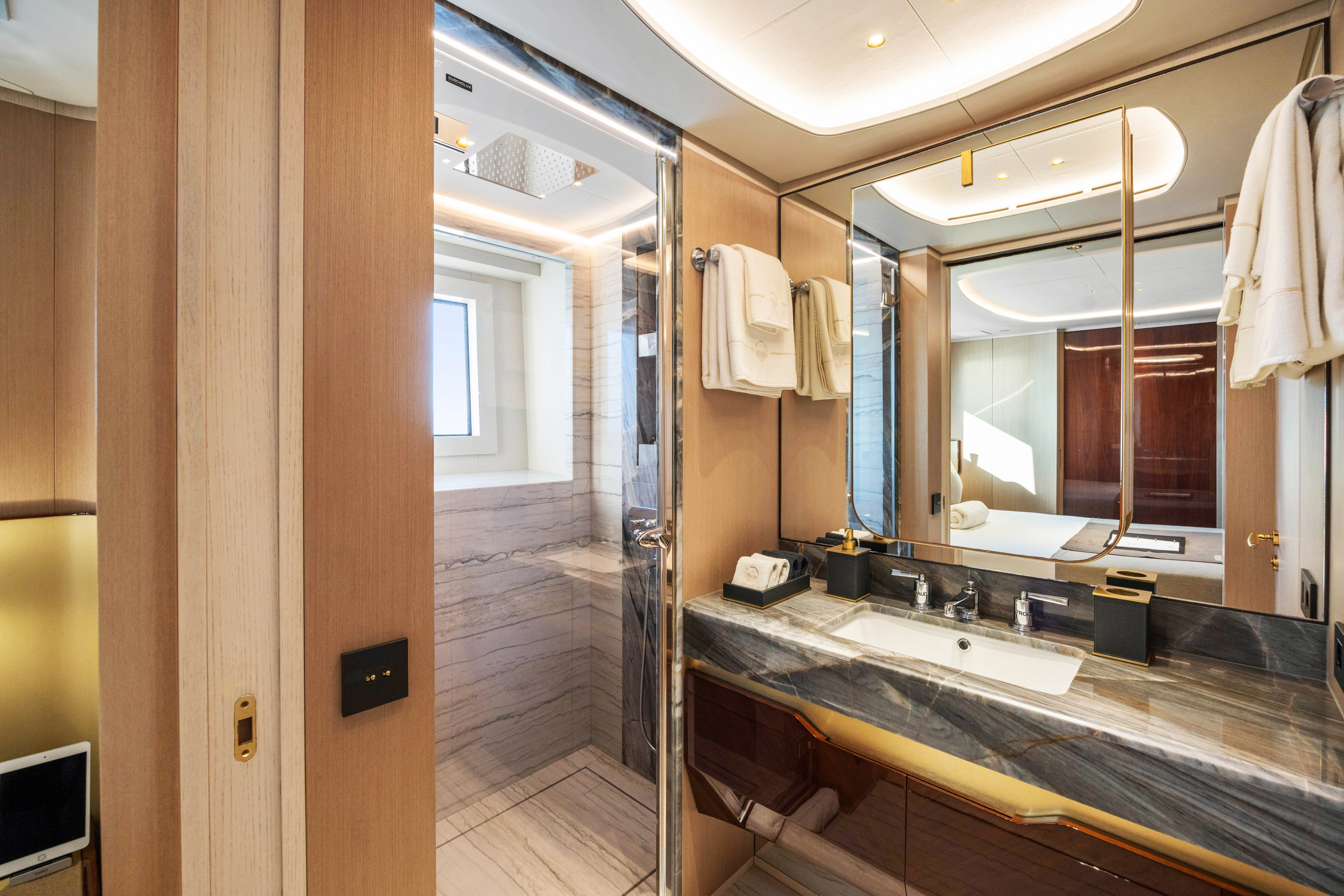 a bathroom with a large mirror aboard TRAMONTO Yacht for Charter