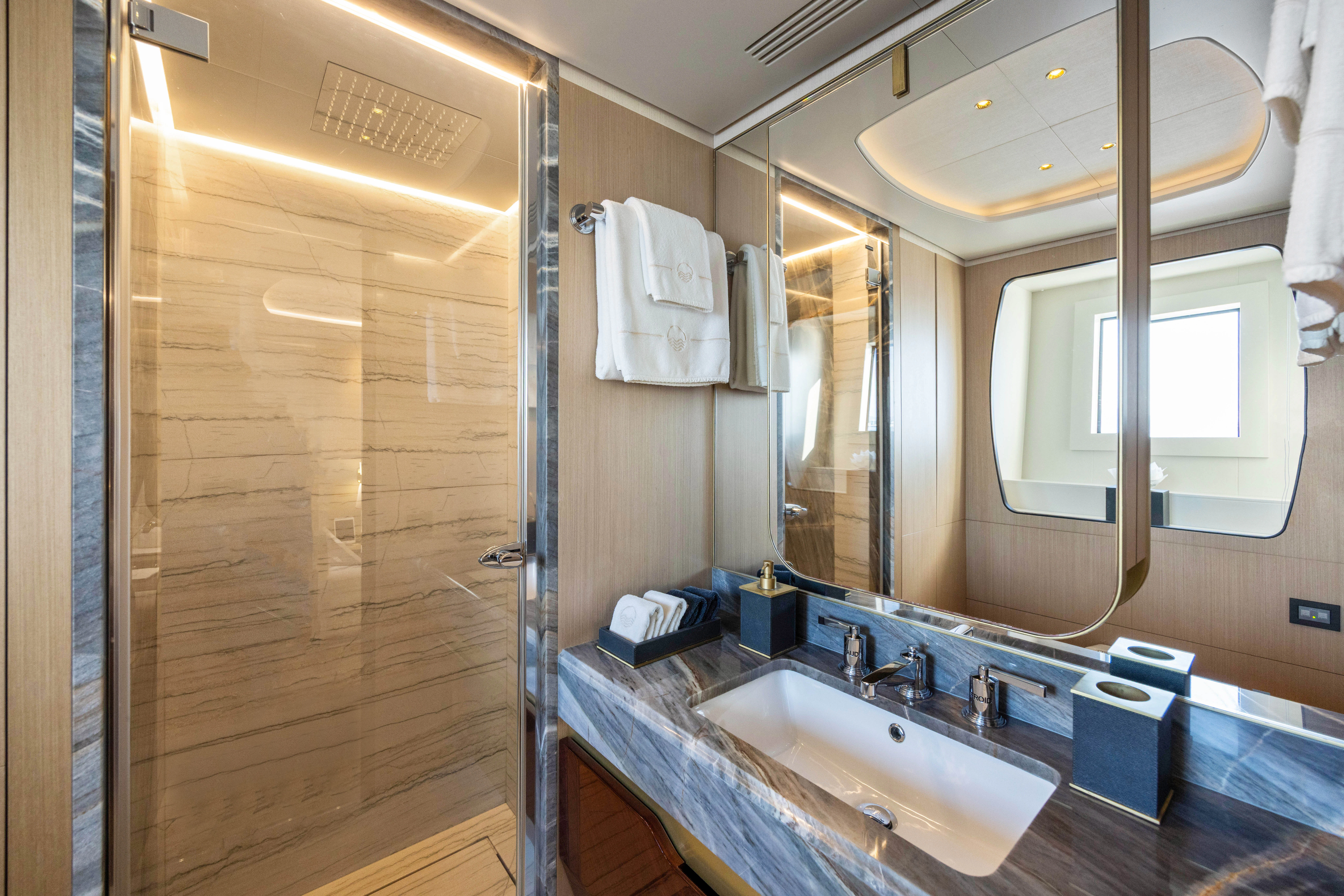 a bathroom with a large mirror aboard TRAMONTO Yacht for Charter