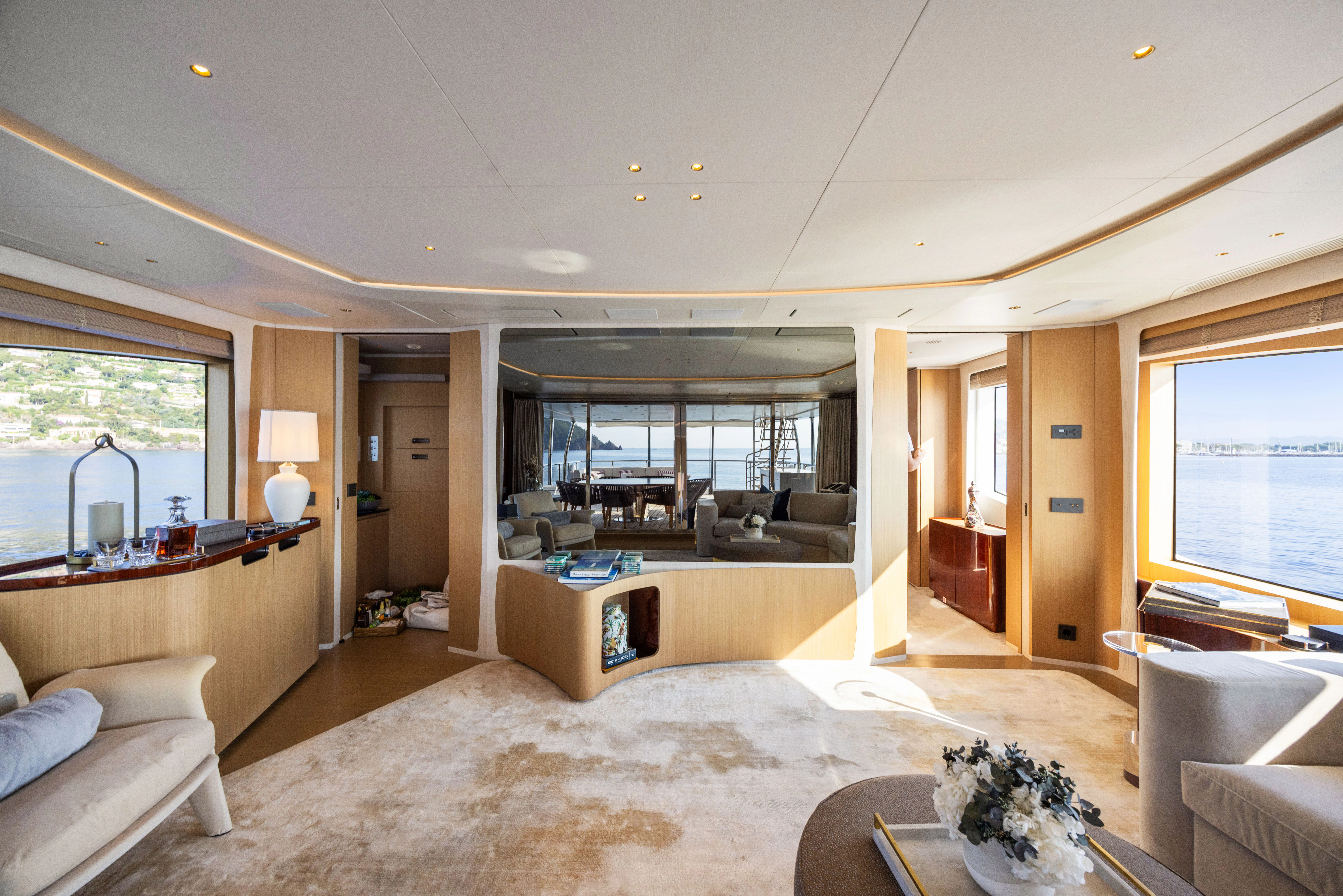 a living room with a large window aboard TRAMONTO Yacht for Charter