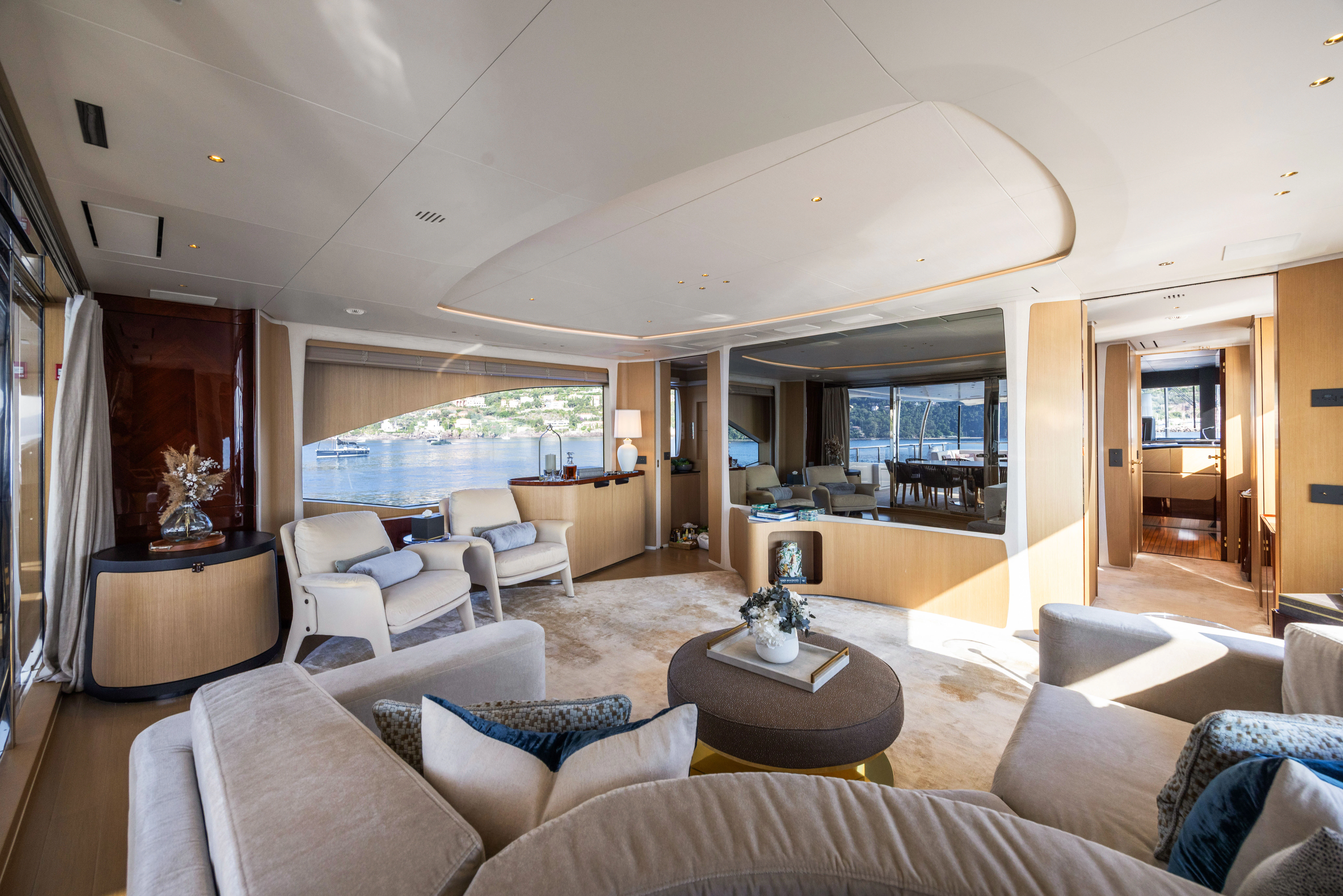 a living room with a large open door aboard TRAMONTO Yacht for Charter