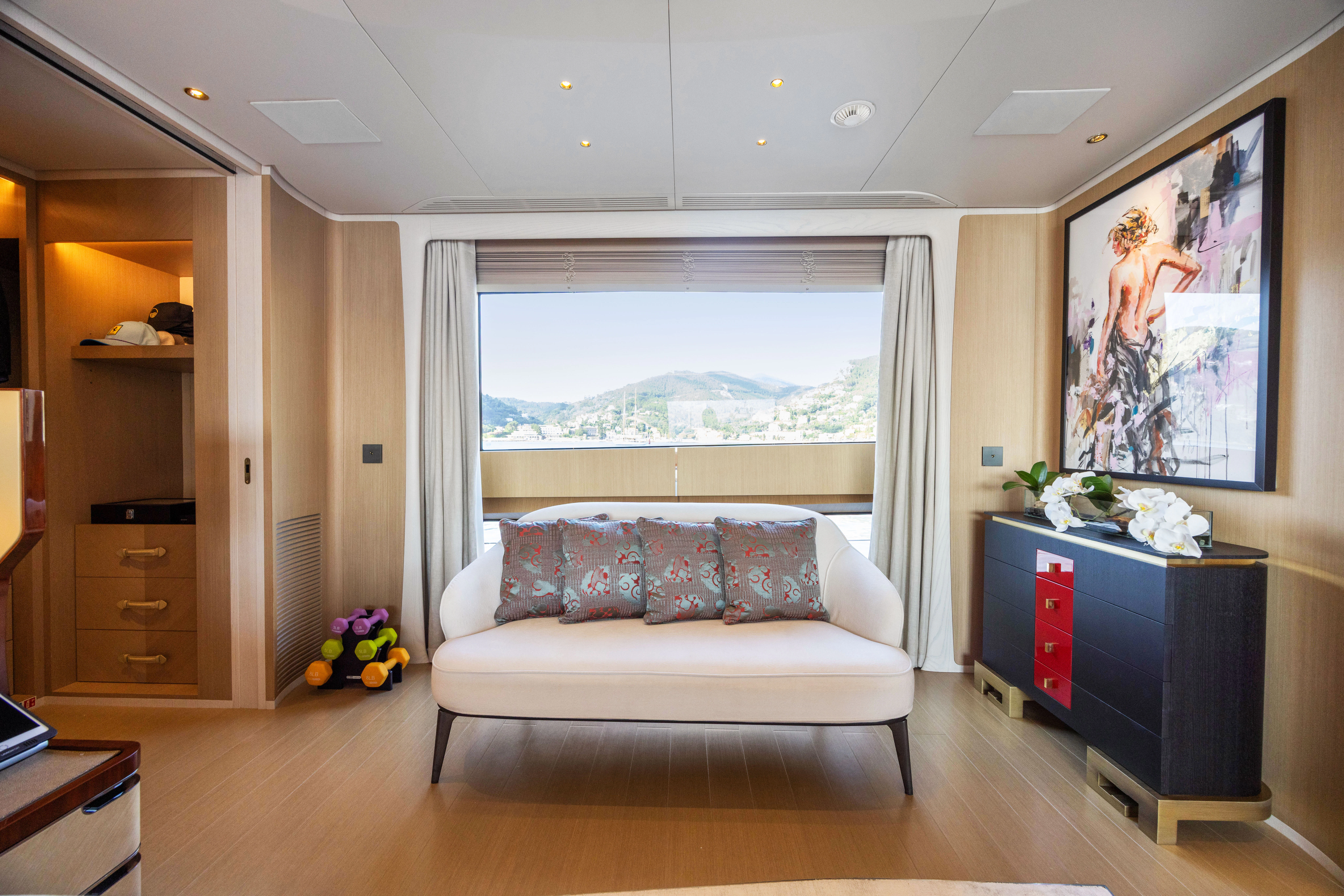 a living room with a large window aboard TRAMONTO Yacht for Charter