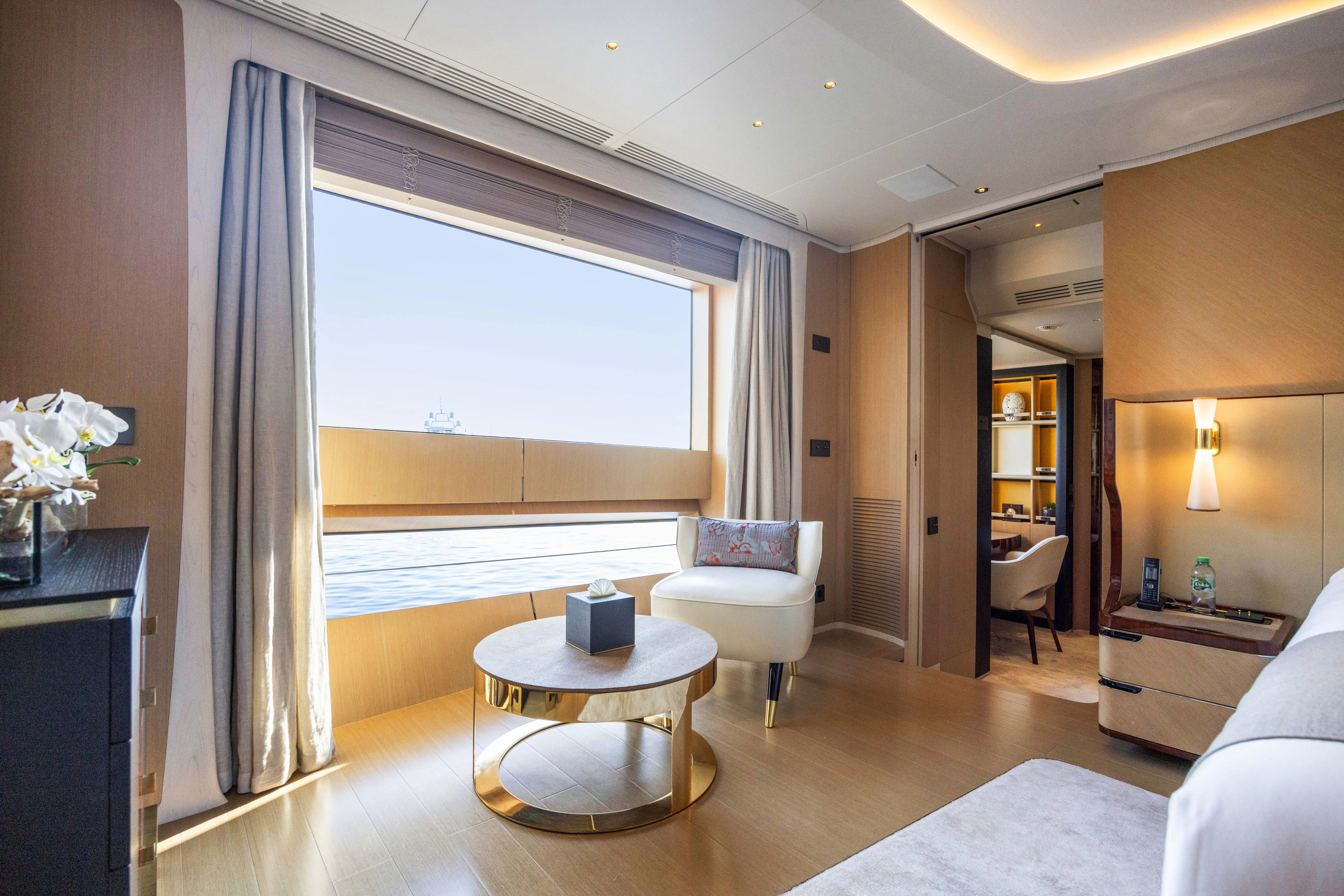 a room with a table and chairs aboard TRAMONTO Yacht for Charter