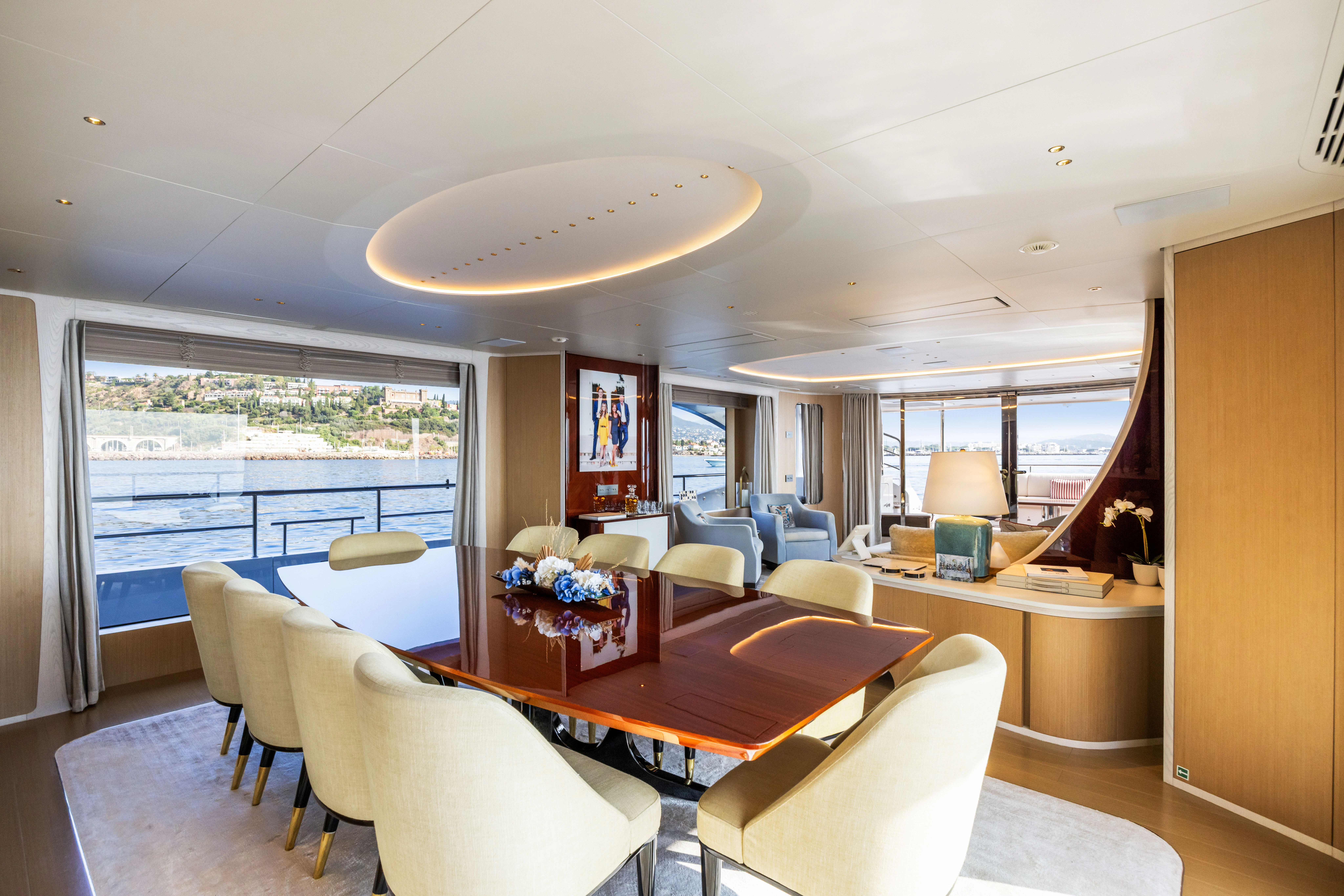 a large living room with a large window aboard TRAMONTO Yacht for Charter