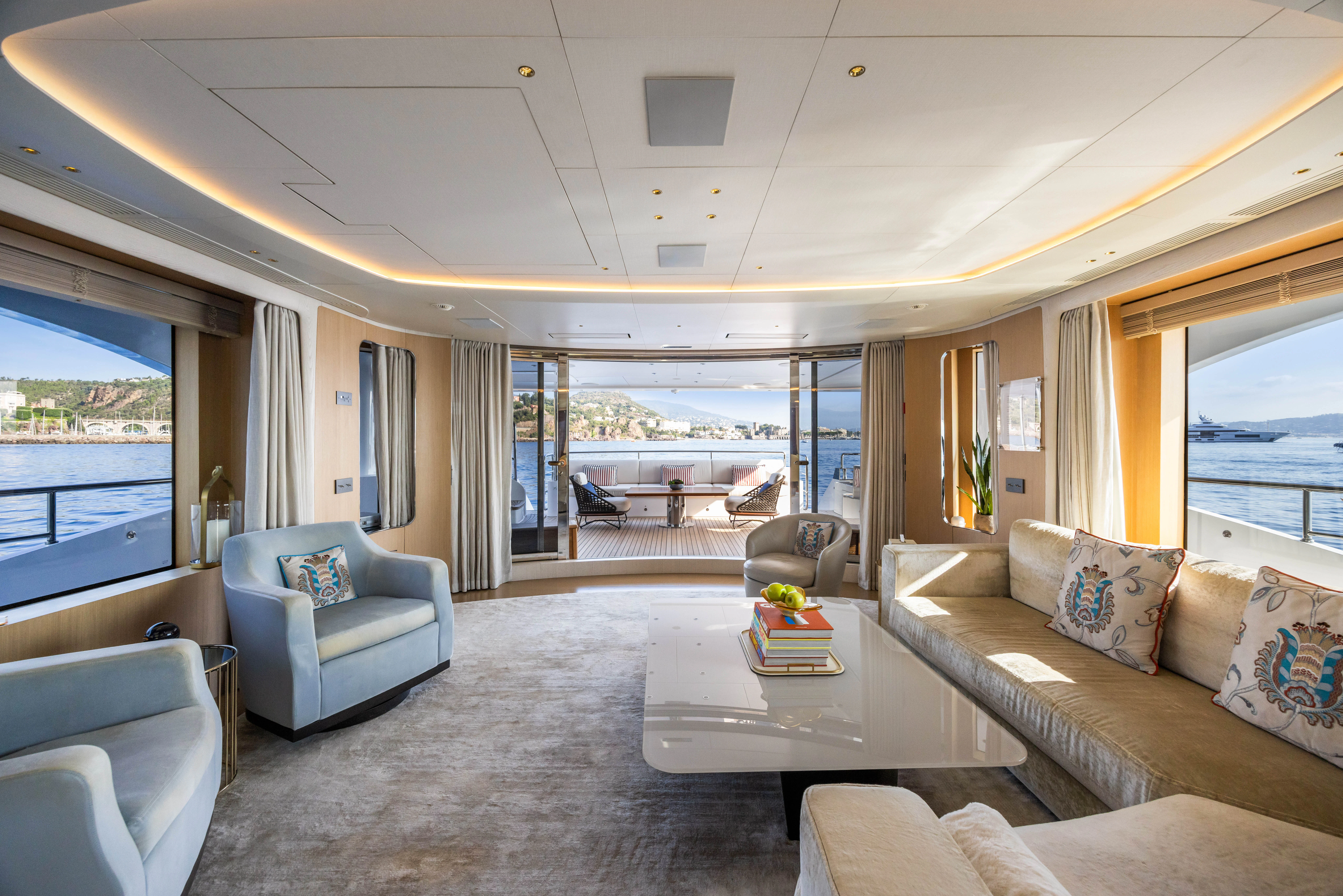 a living room with a large window aboard TRAMONTO Yacht for Charter