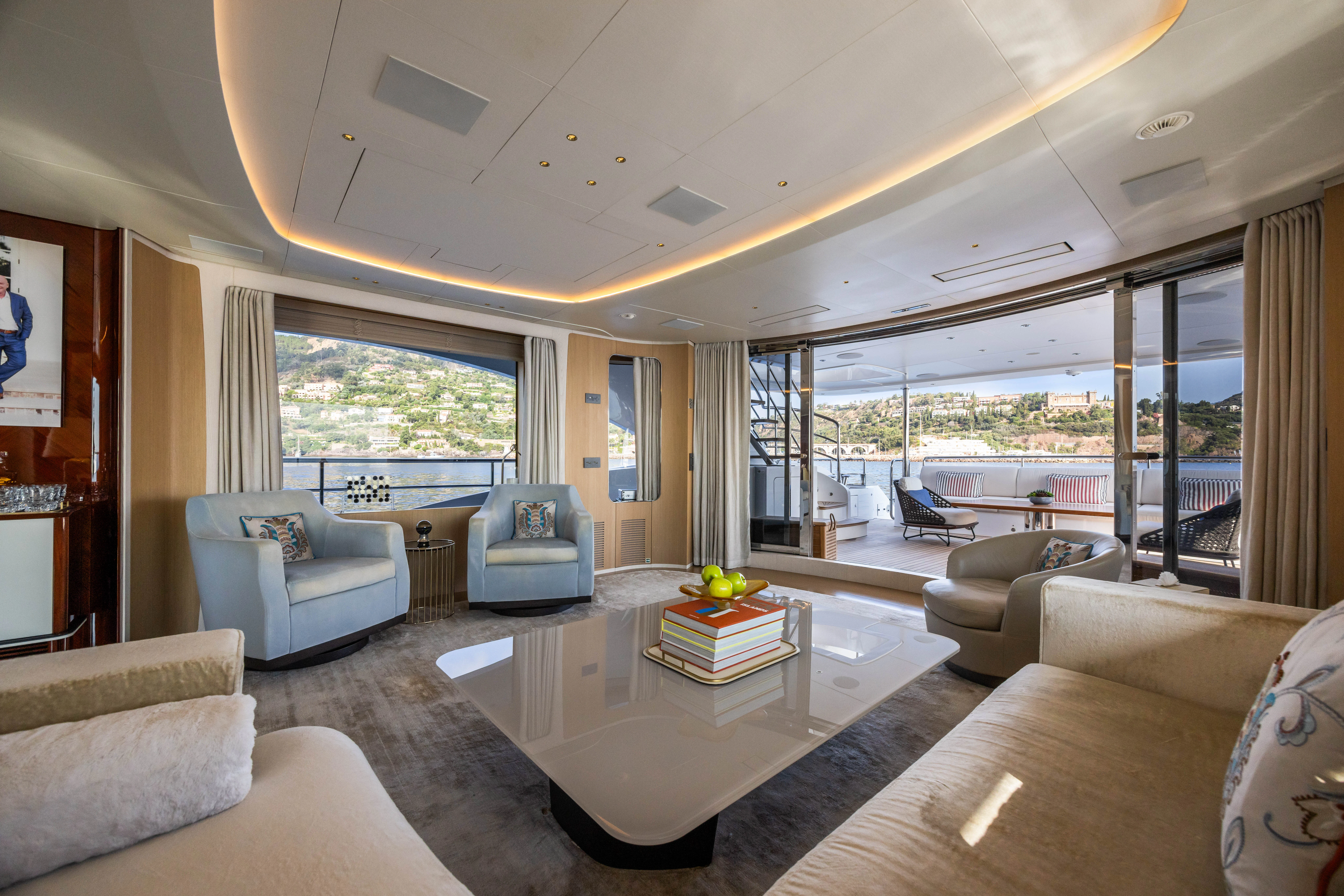 a living room with a large window aboard TRAMONTO Yacht for Charter