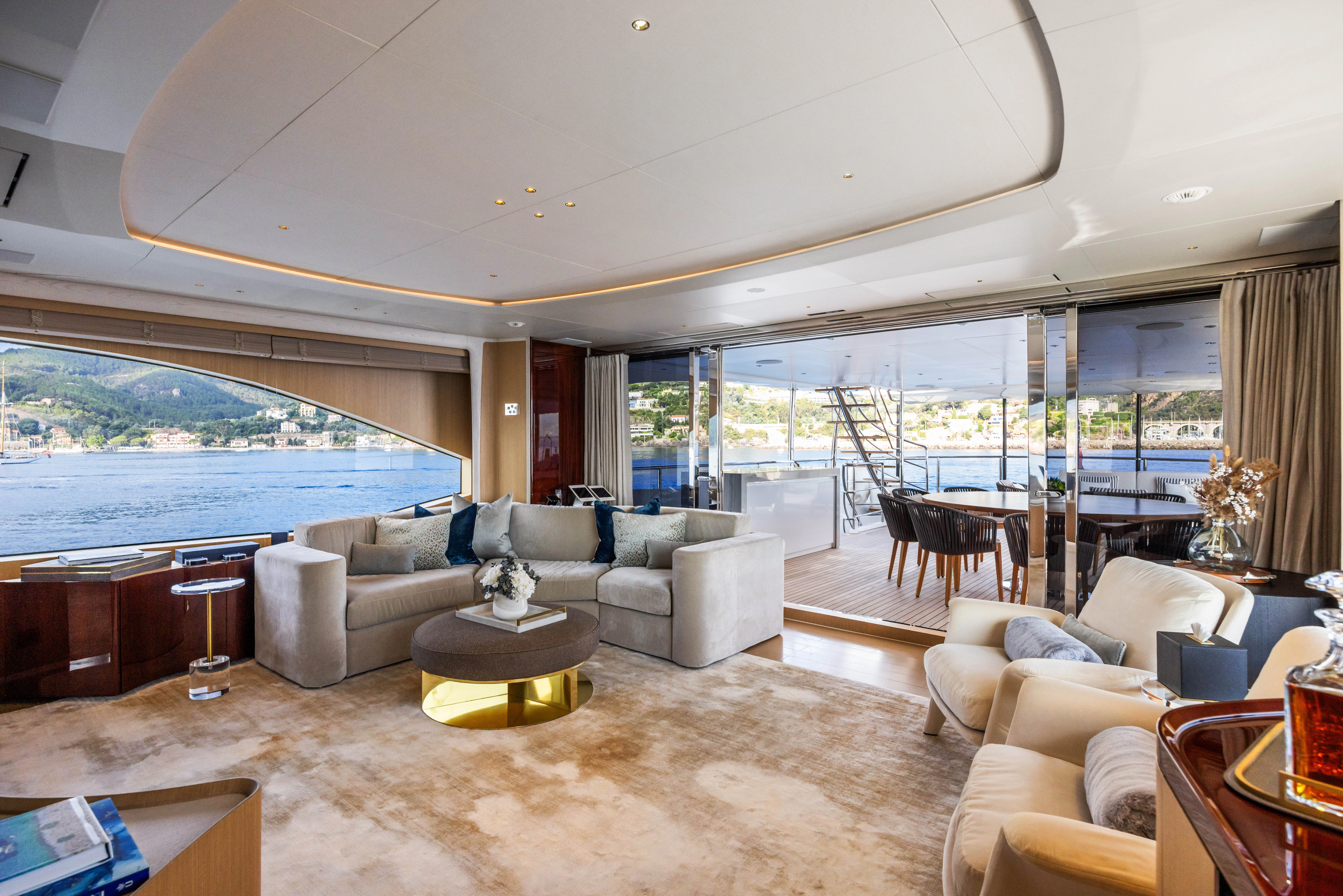 a living room with a large glass window aboard TRAMONTO Yacht for Charter