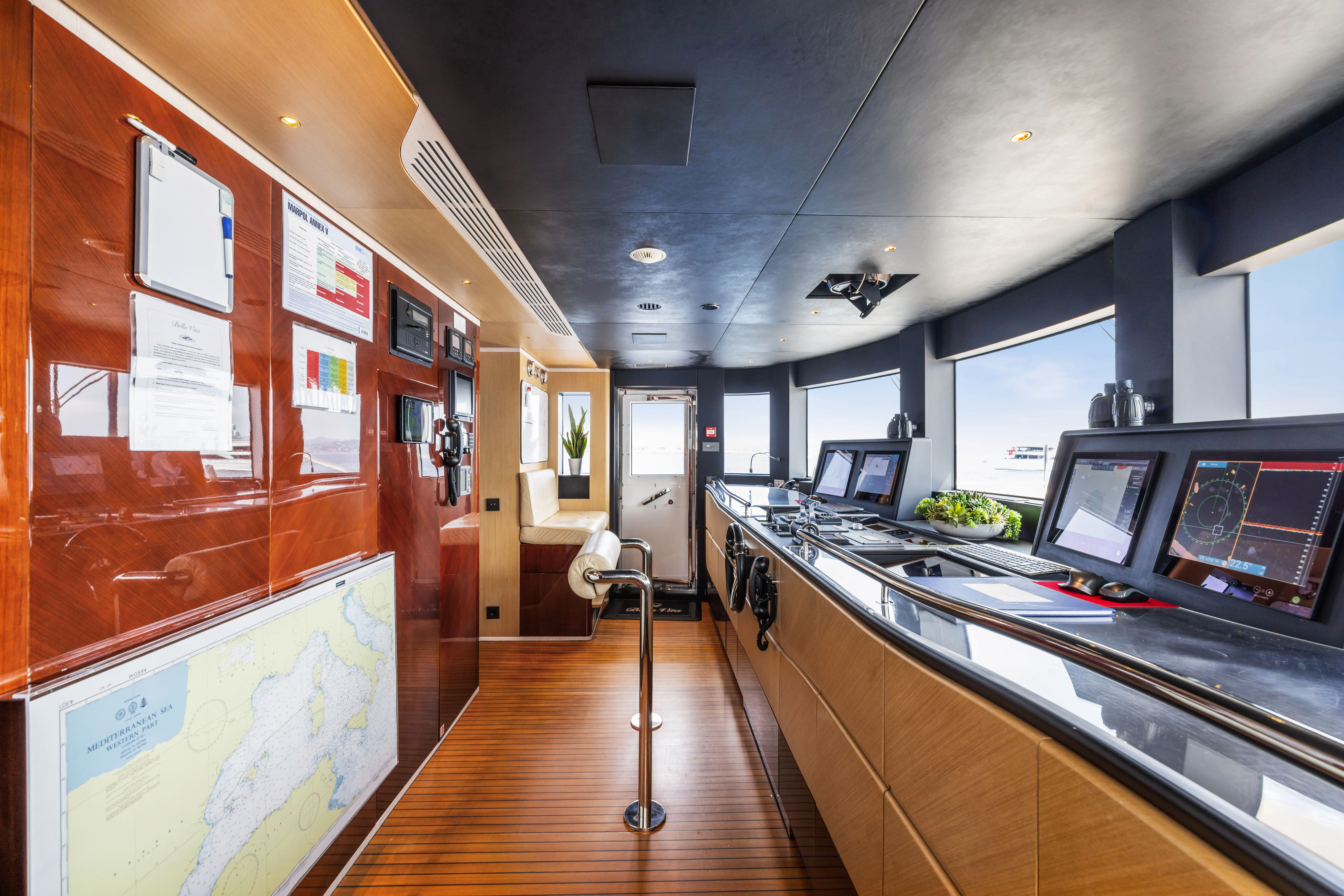 a kitchen with a large island aboard TRAMONTO Yacht for Charter