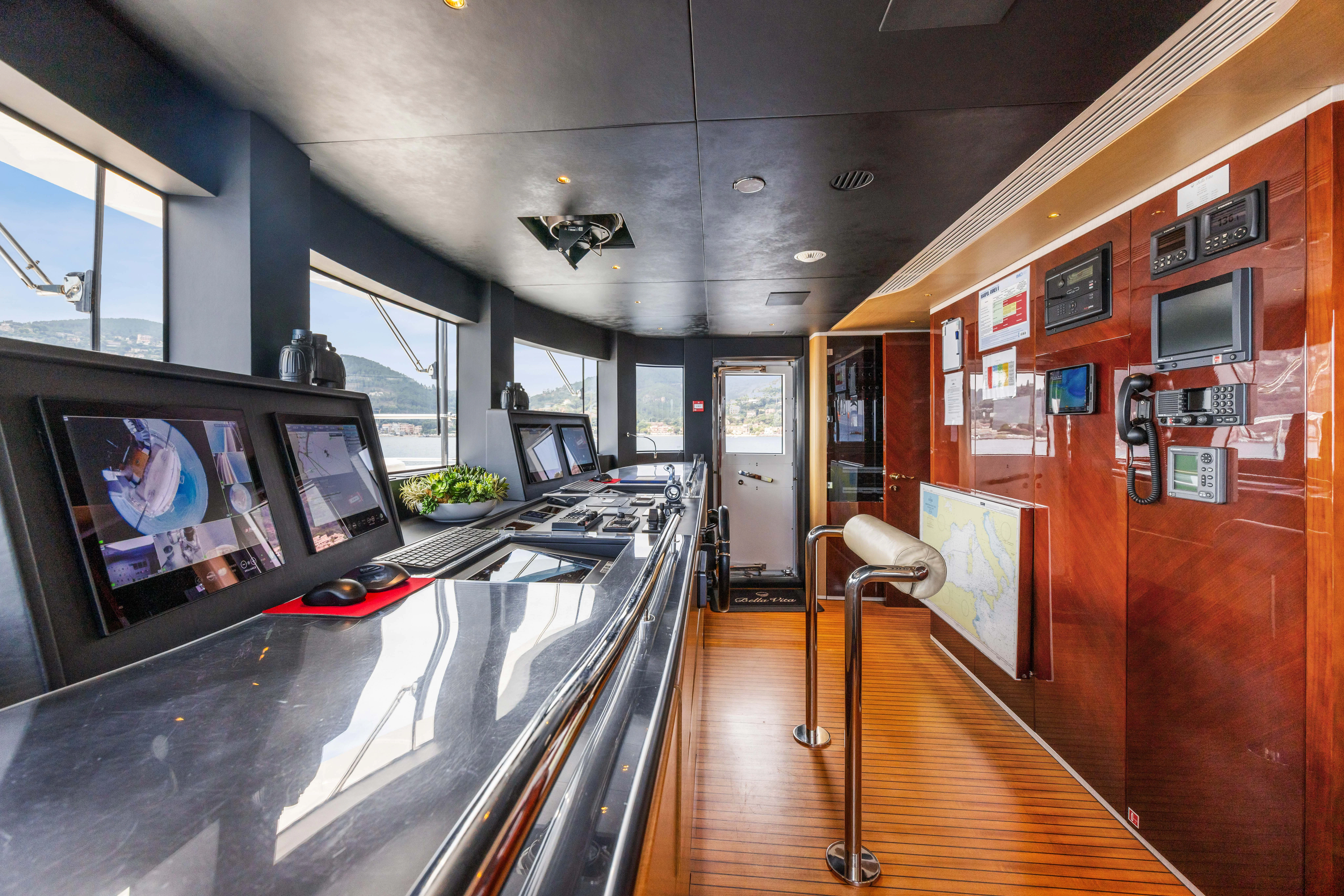 a room with a counter and tv aboard TRAMONTO Yacht for Charter