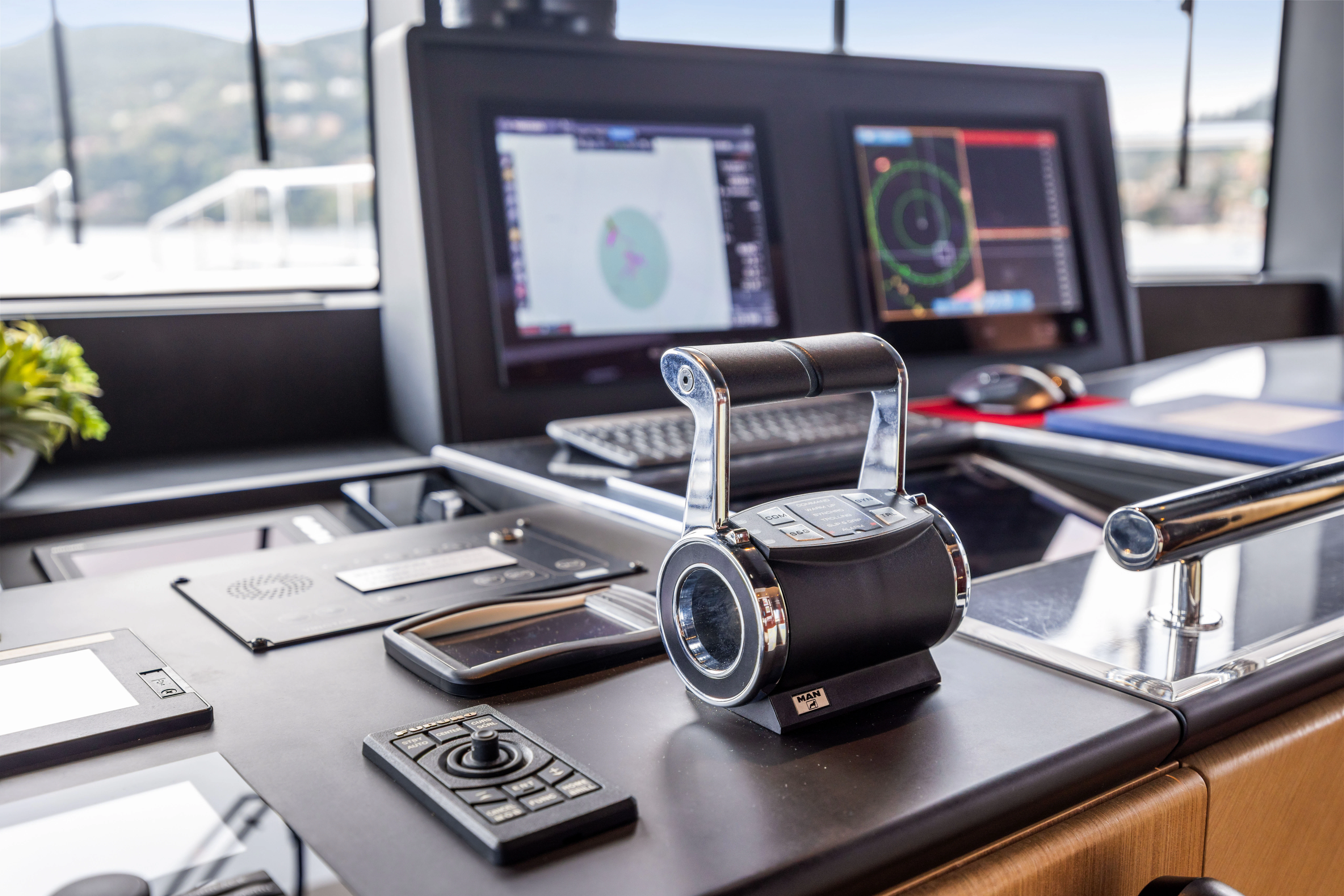 a camera on a desk aboard TRAMONTO Yacht for Charter