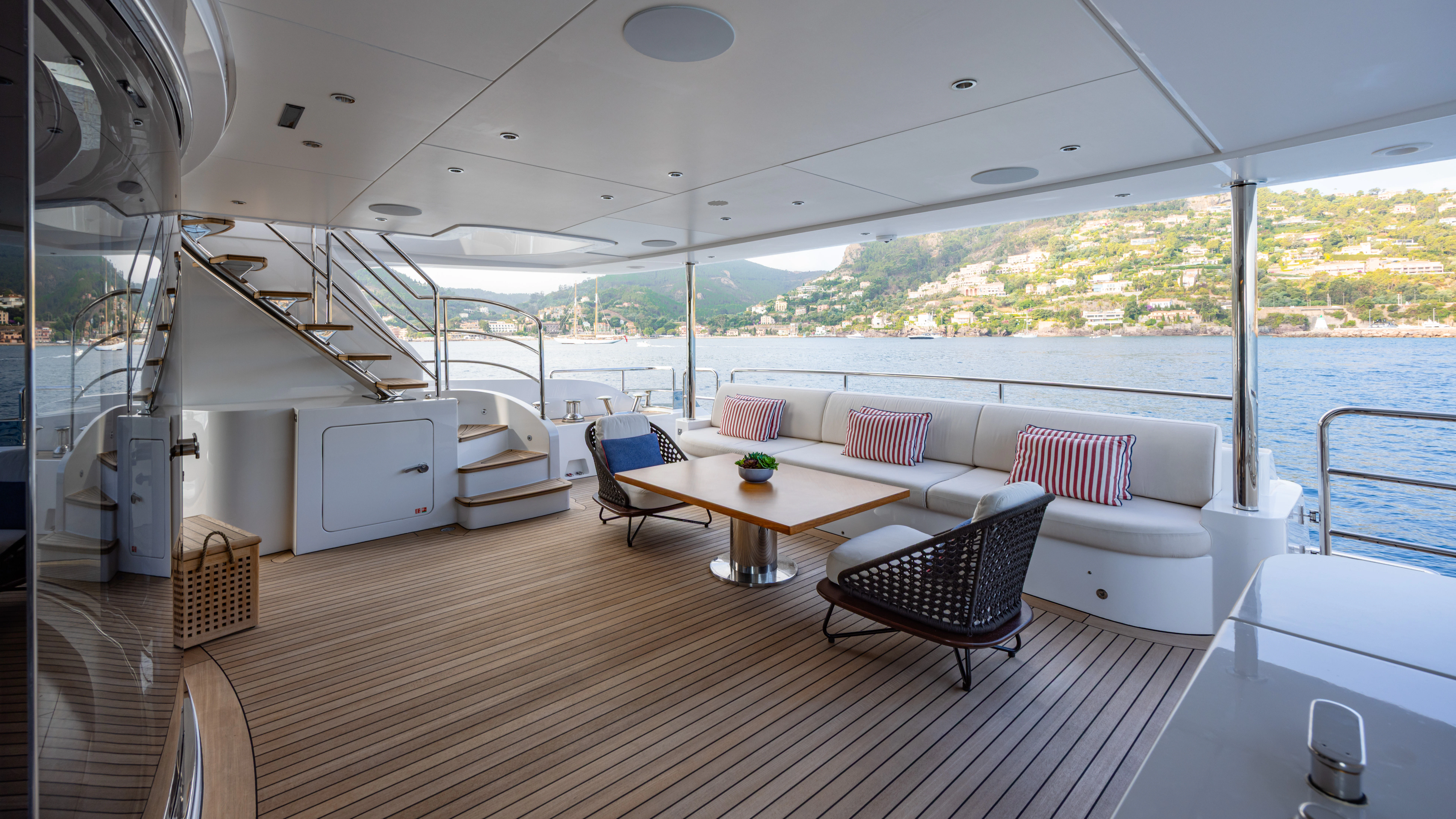 a boat with a table and chairs aboard TRAMONTO Yacht for Charter
