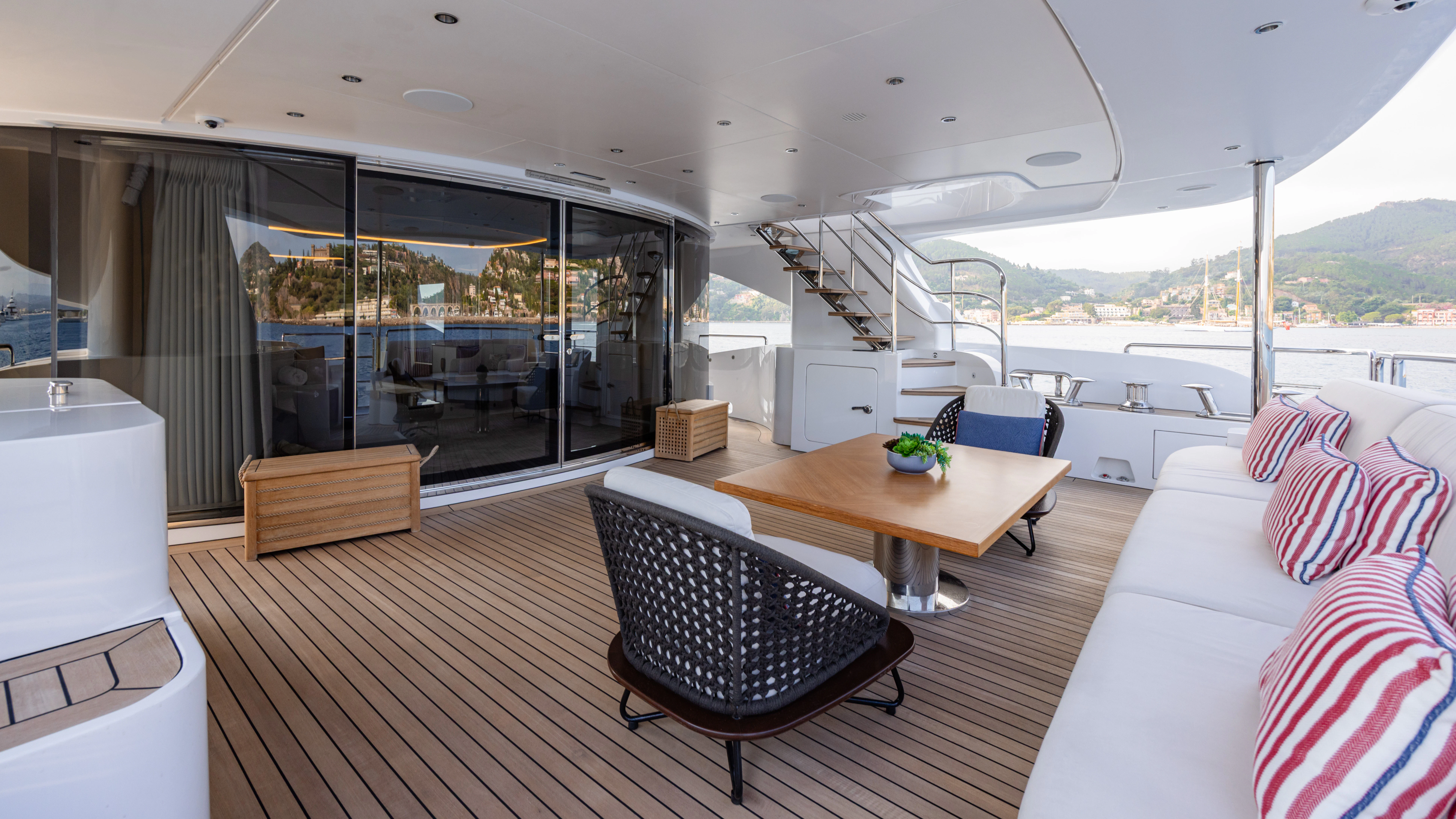 a living room with a table and chairs aboard TRAMONTO Yacht for Charter