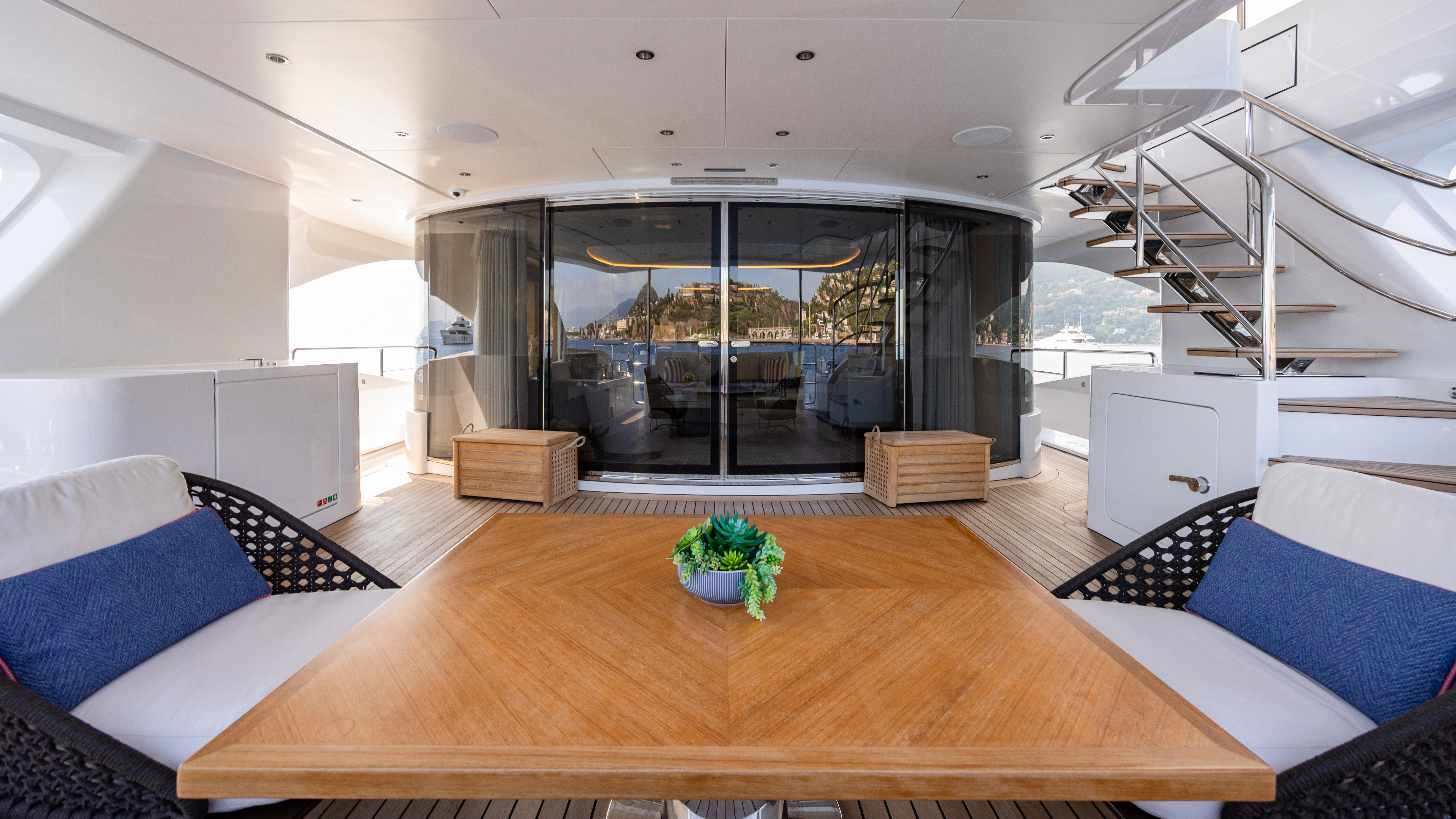 a room with a table and couches aboard TRAMONTO Yacht for Charter