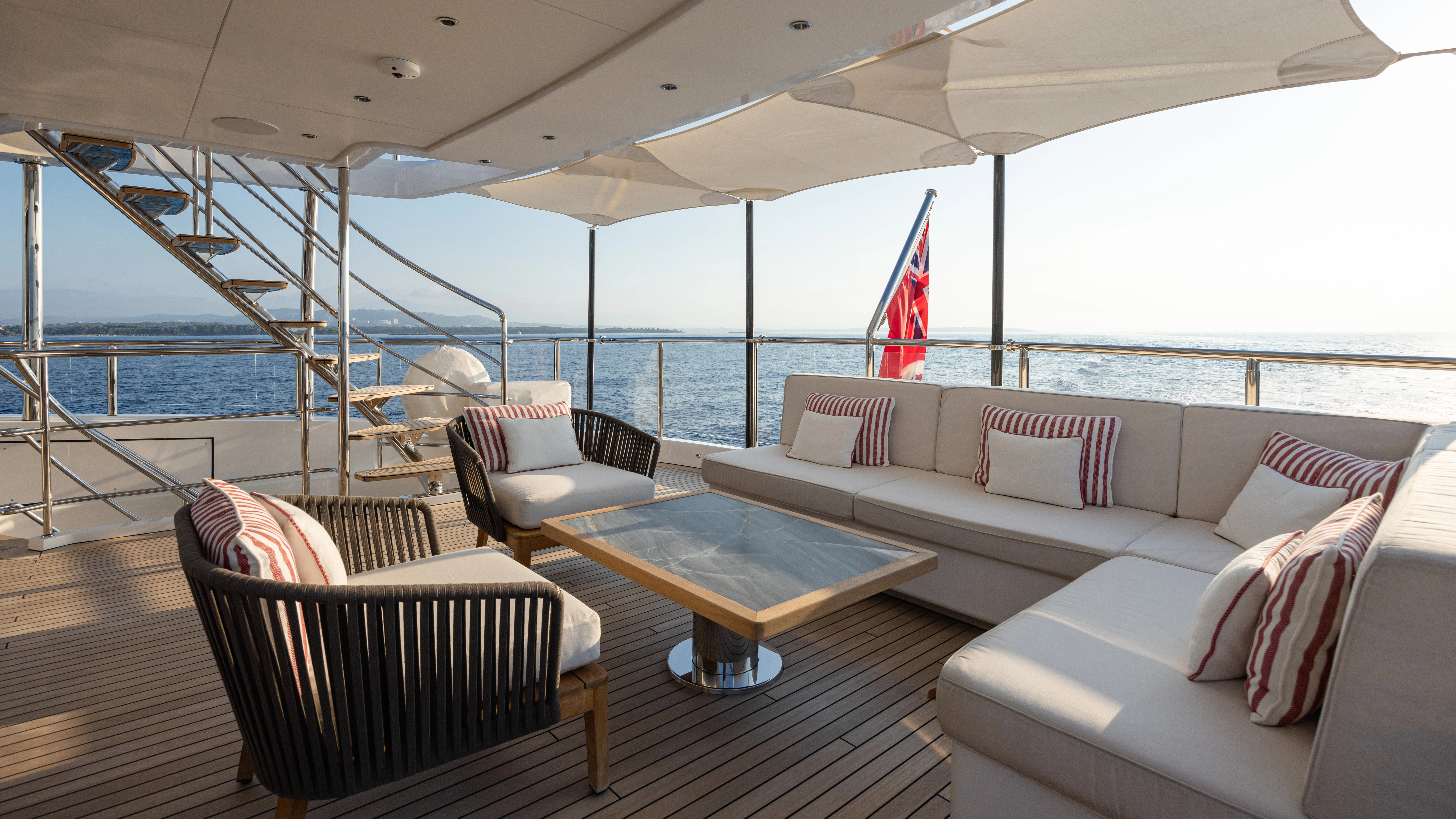 a large living room with a large balcony aboard TRAMONTO Yacht for Charter