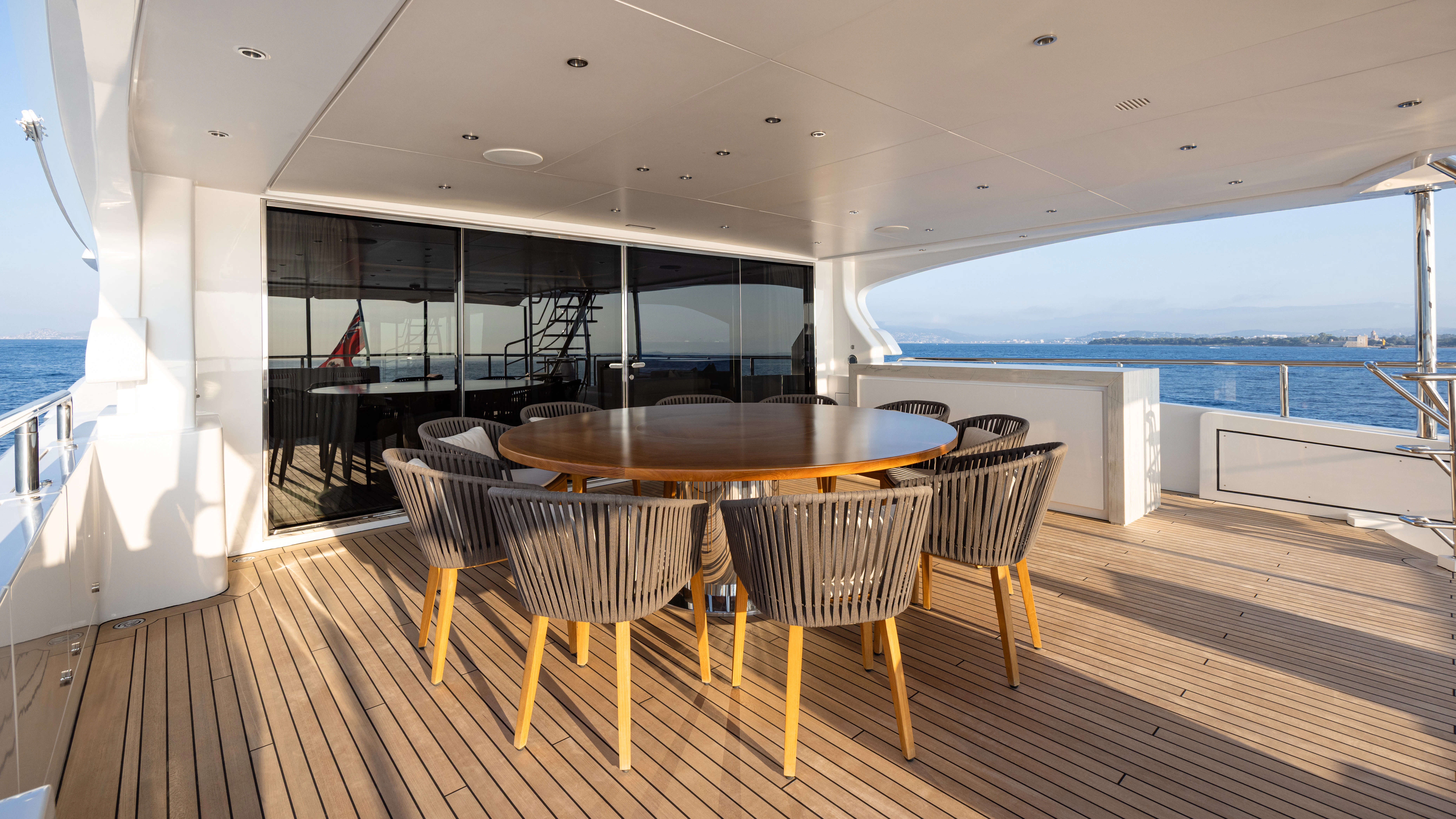 a room with a table and chairs aboard TRAMONTO Yacht for Charter