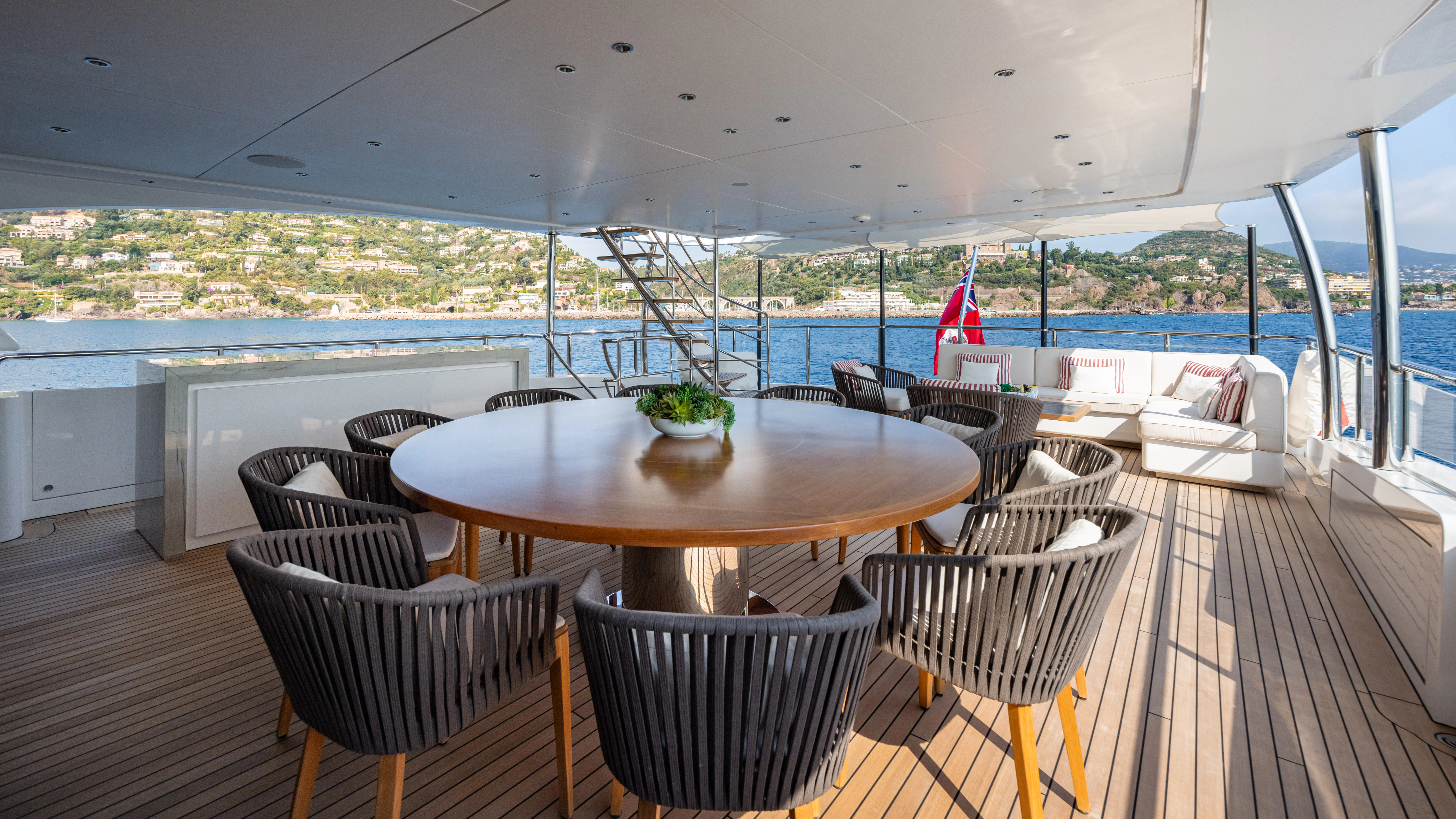 a table and chairs on a deck aboard TRAMONTO Yacht for Charter