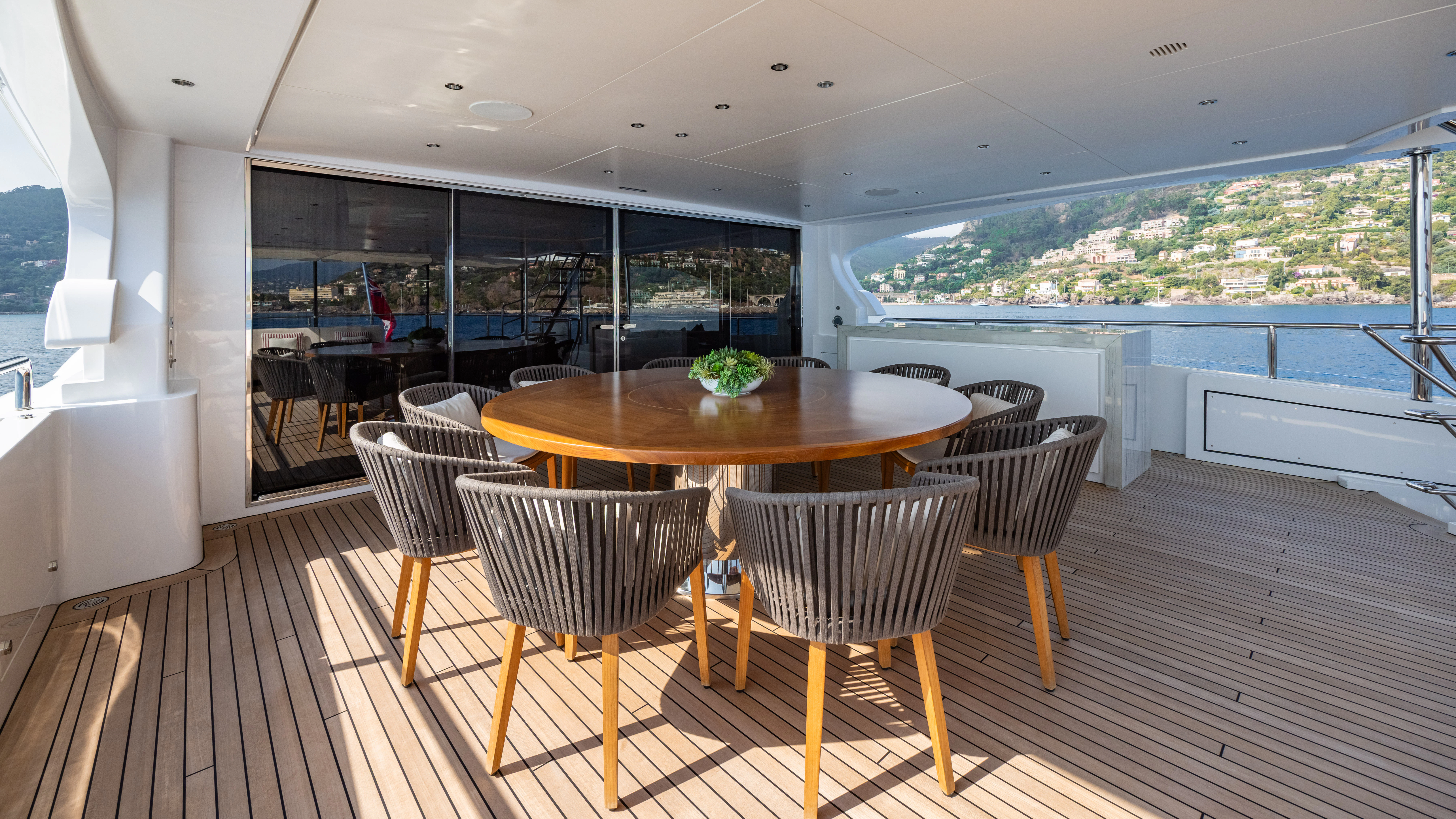 a table and chairs in a room aboard TRAMONTO Yacht for Charter