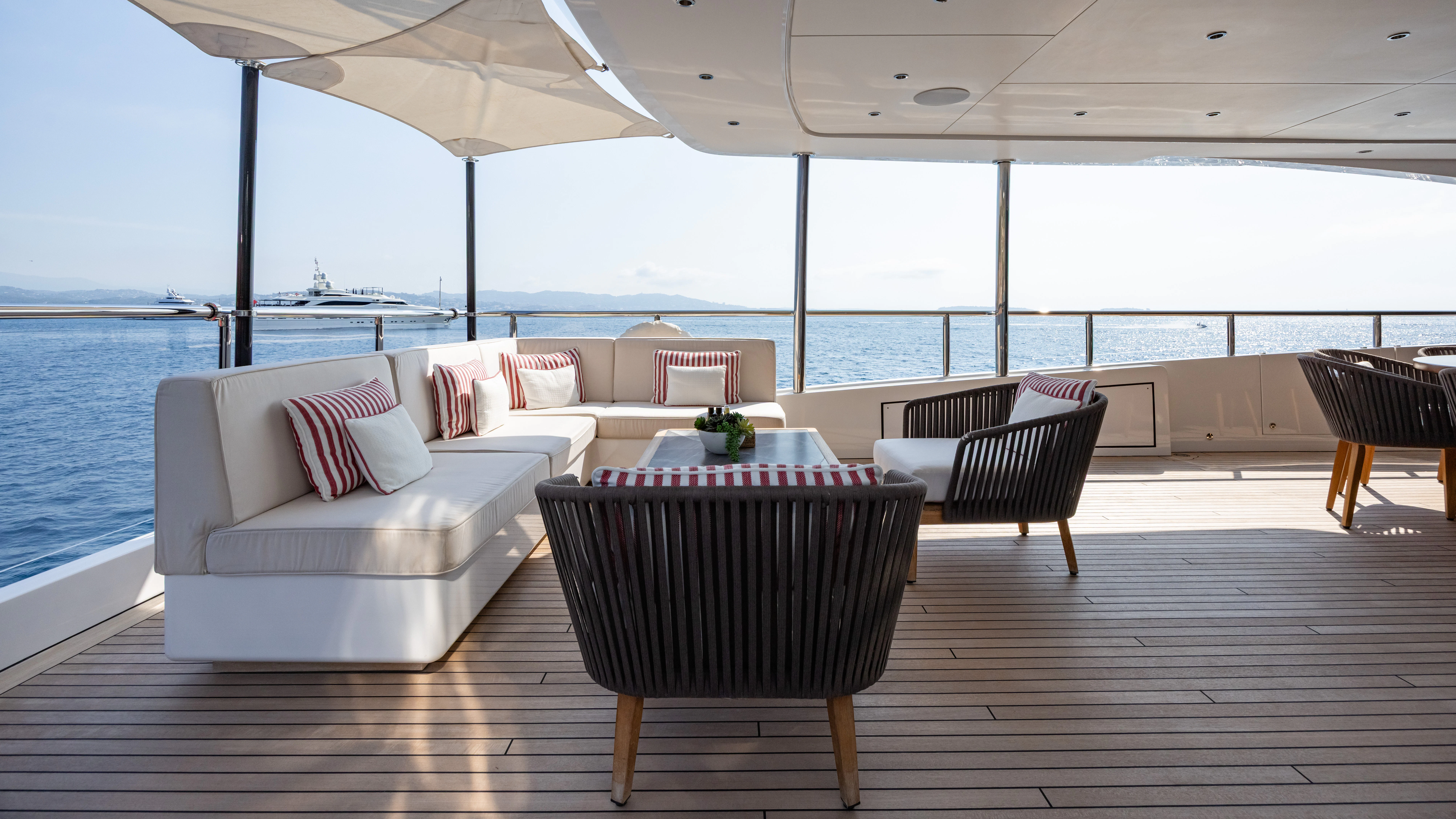 a room with a table and chairs aboard TRAMONTO Yacht for Charter