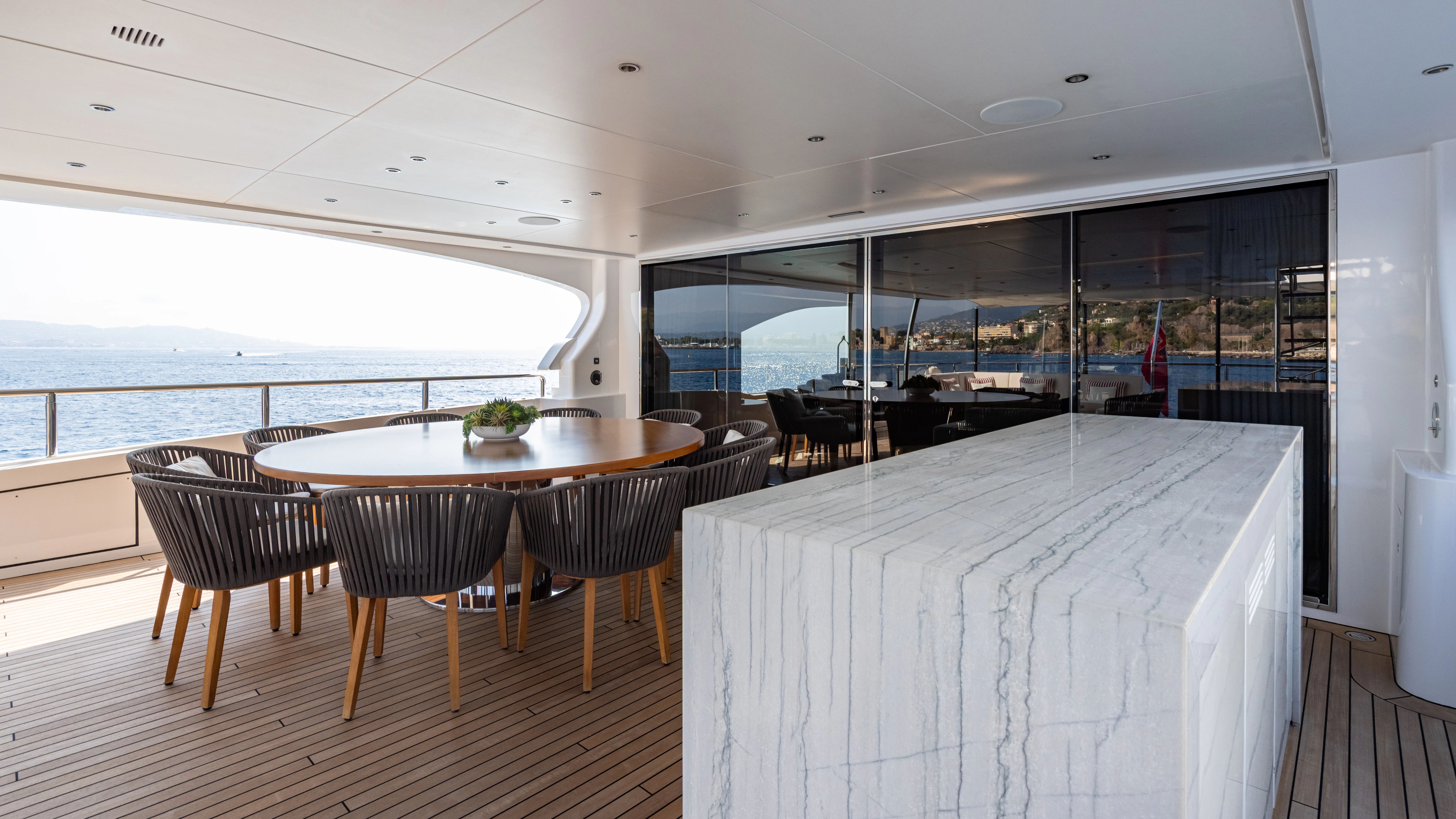a room with a table and chairs aboard TRAMONTO Yacht for Charter