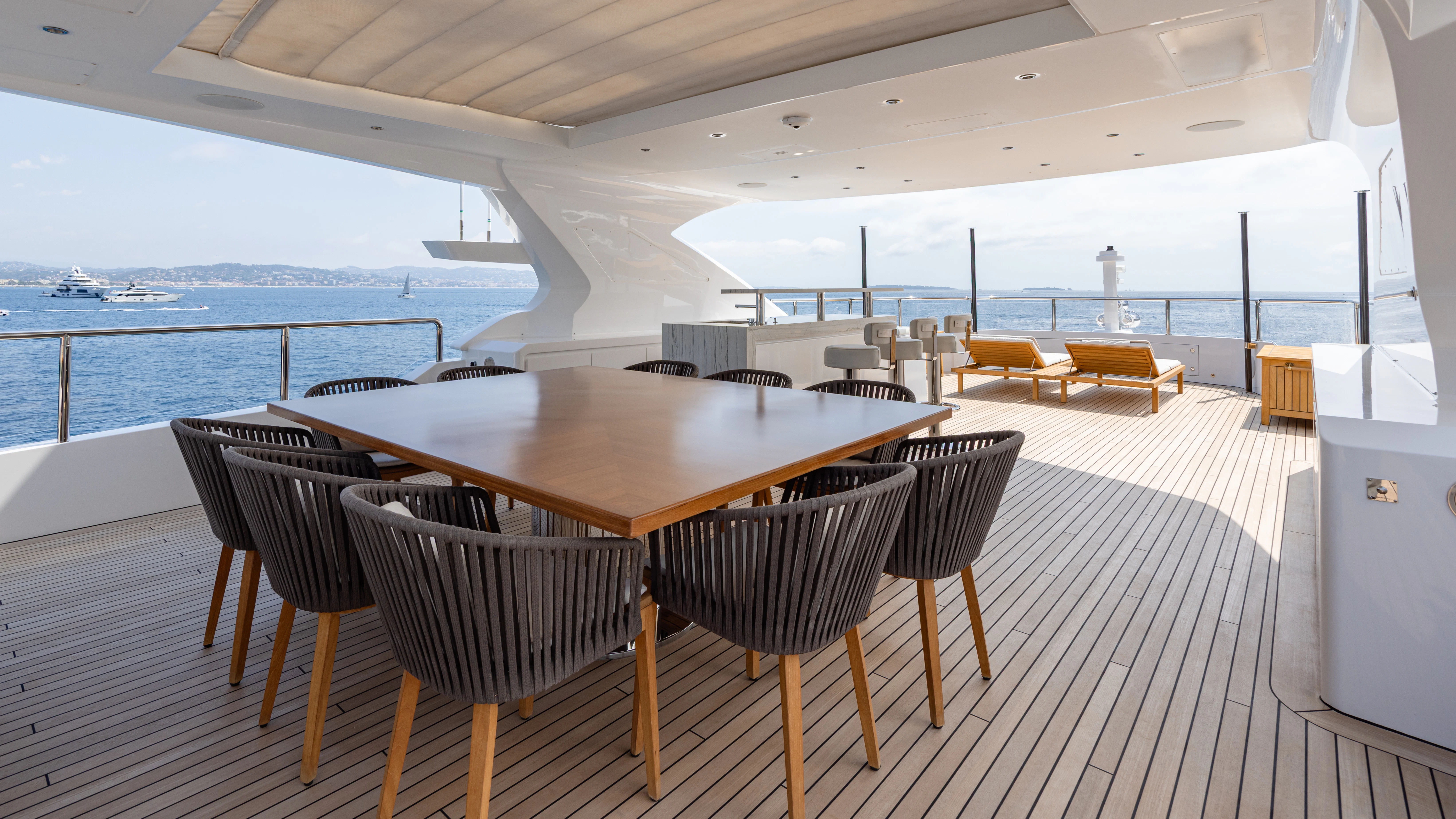 a table and chairs on a deck aboard TRAMONTO Yacht for Charter