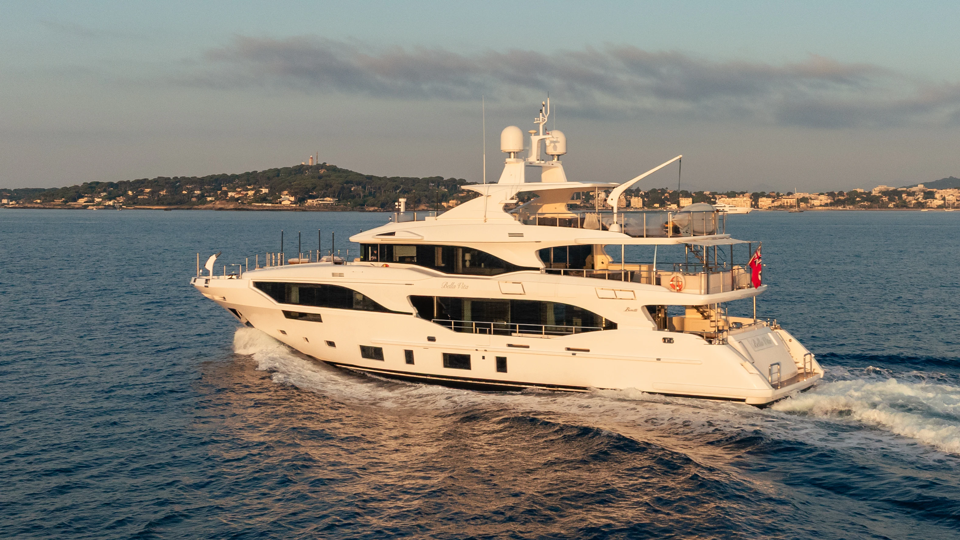 a white boat on the water aboard TRAMONTO Yacht for Charter