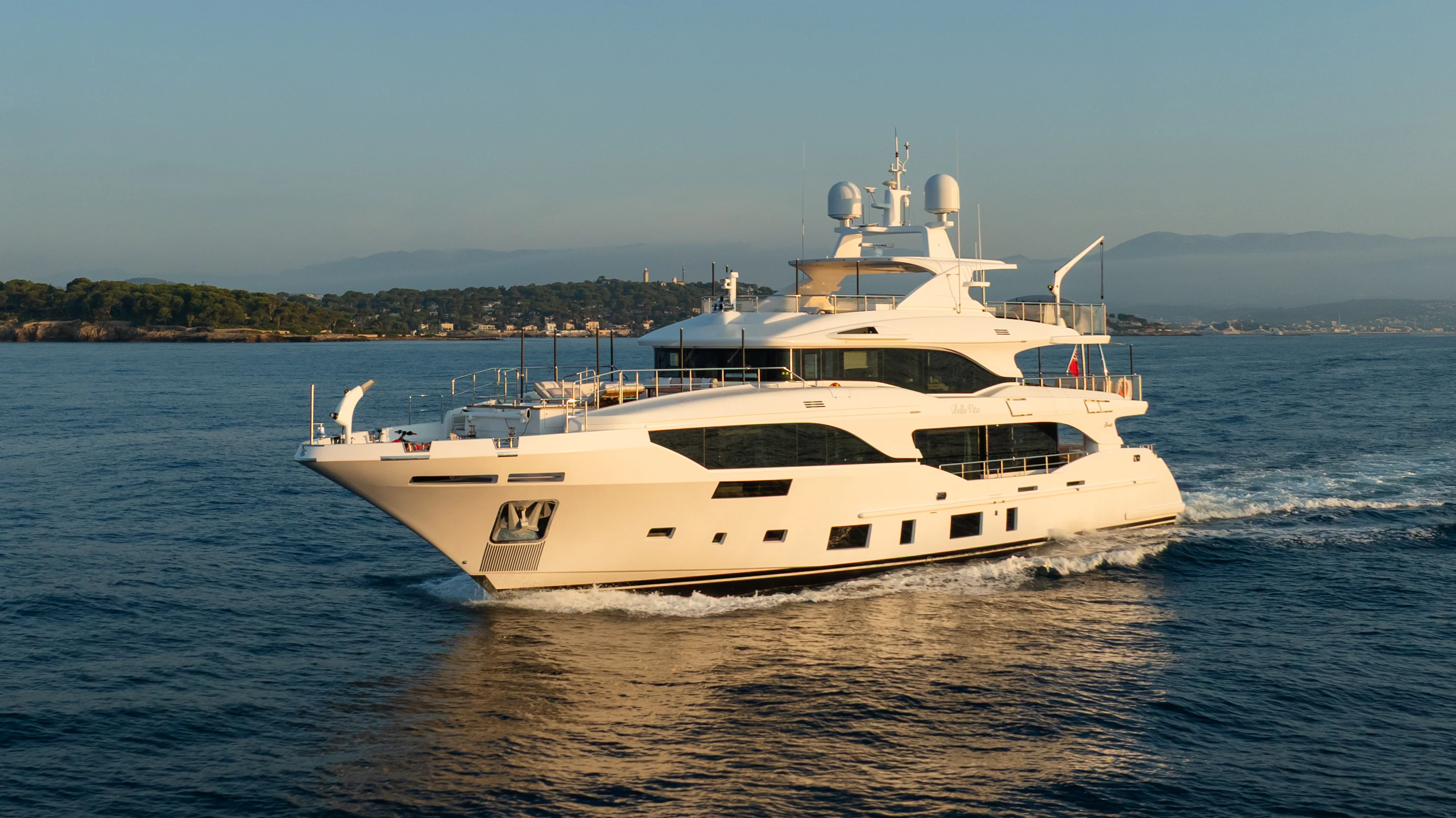 a white boat in the water aboard TRAMONTO Yacht for Charter