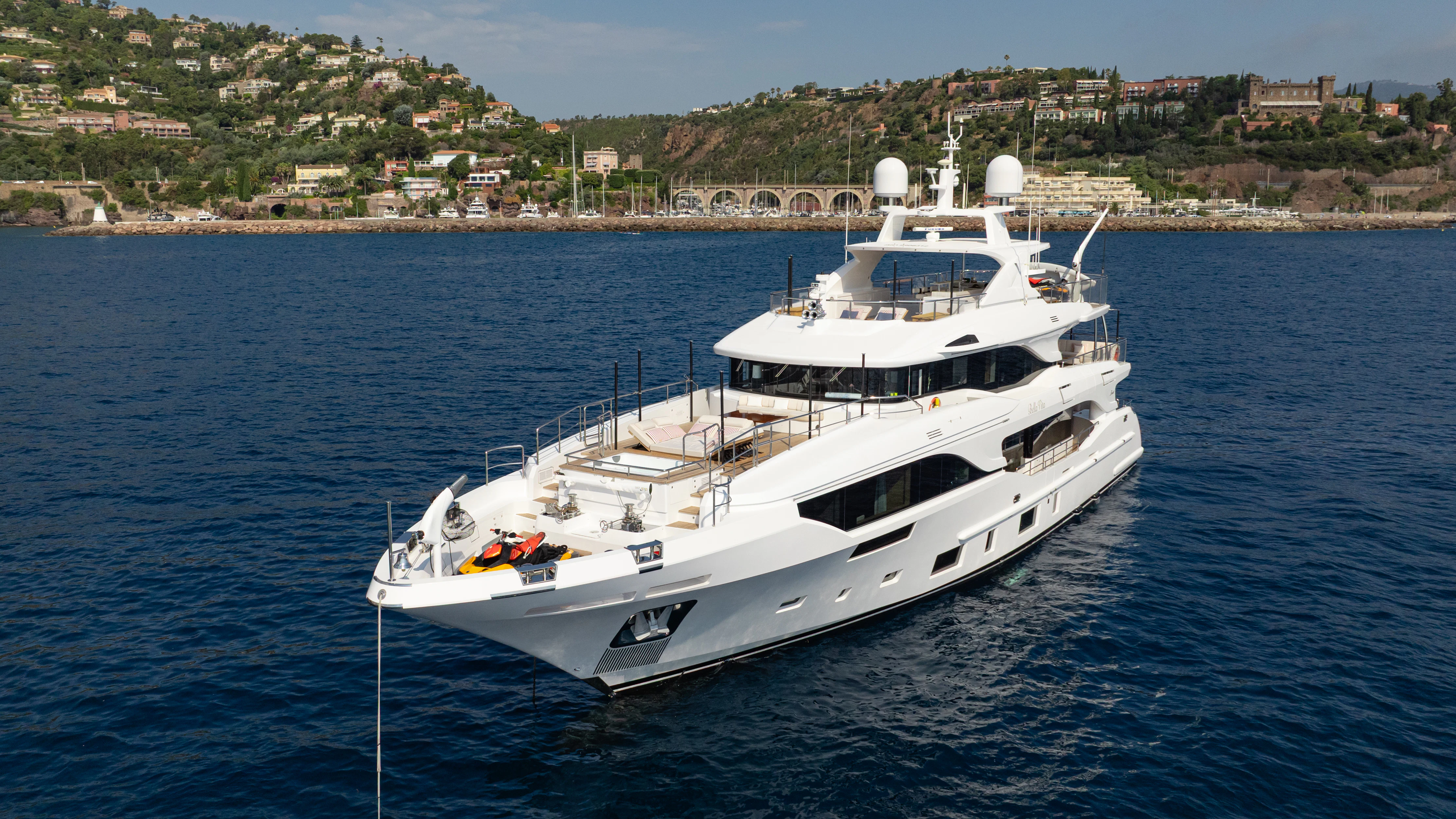 a white boat in the water aboard TRAMONTO Yacht for Charter