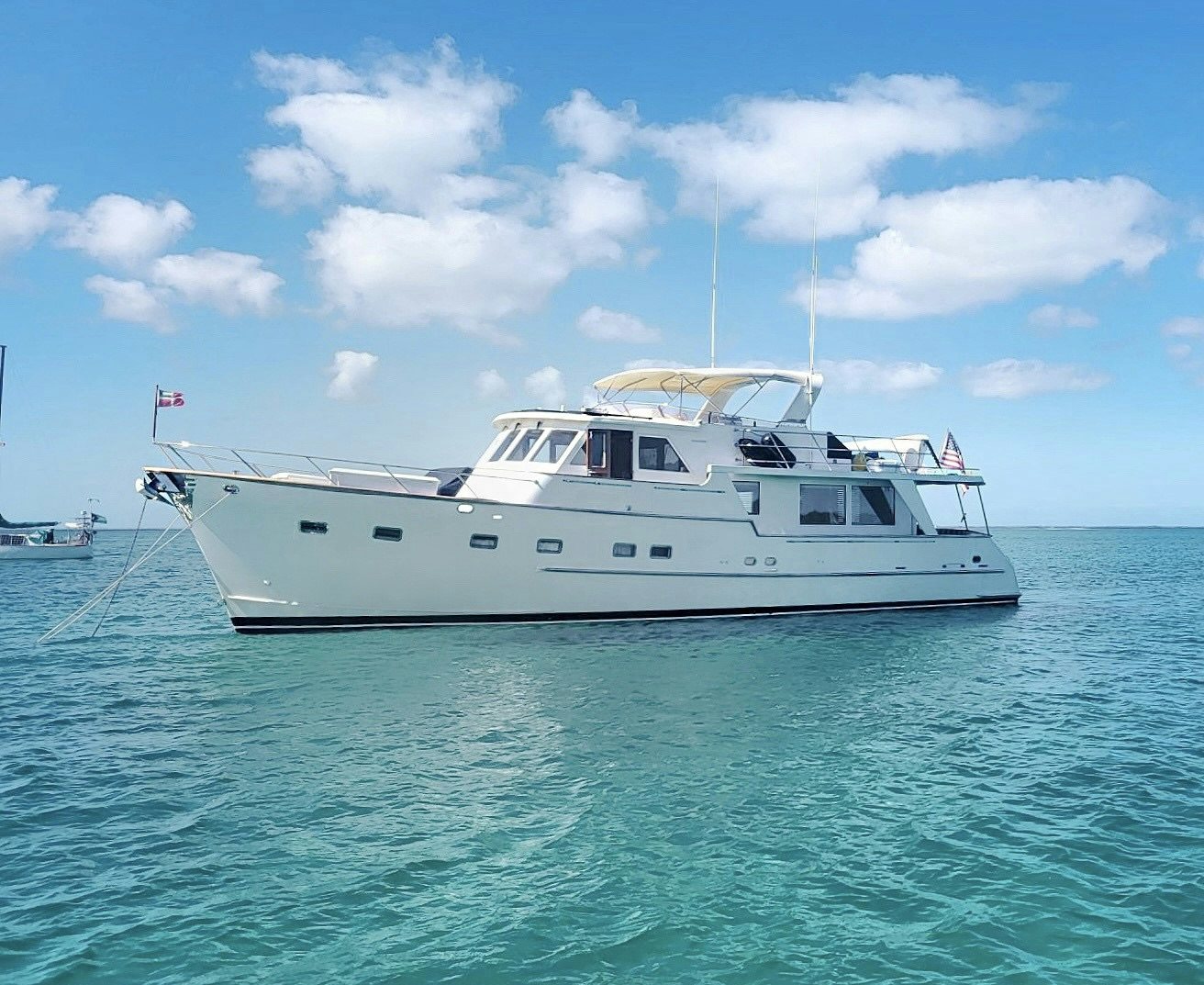 a white boat in the water aboard SYNERGY Yacht for Sale