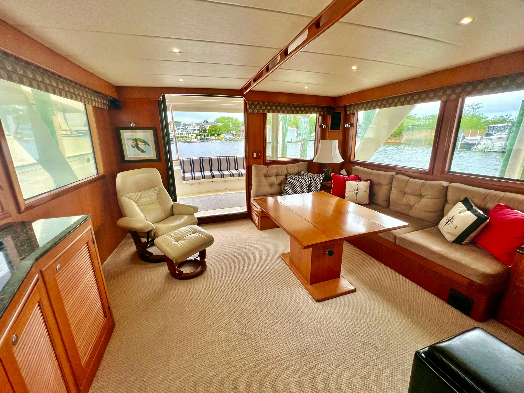 a living room with a couch and a table aboard SYNERGY Yacht for Sale