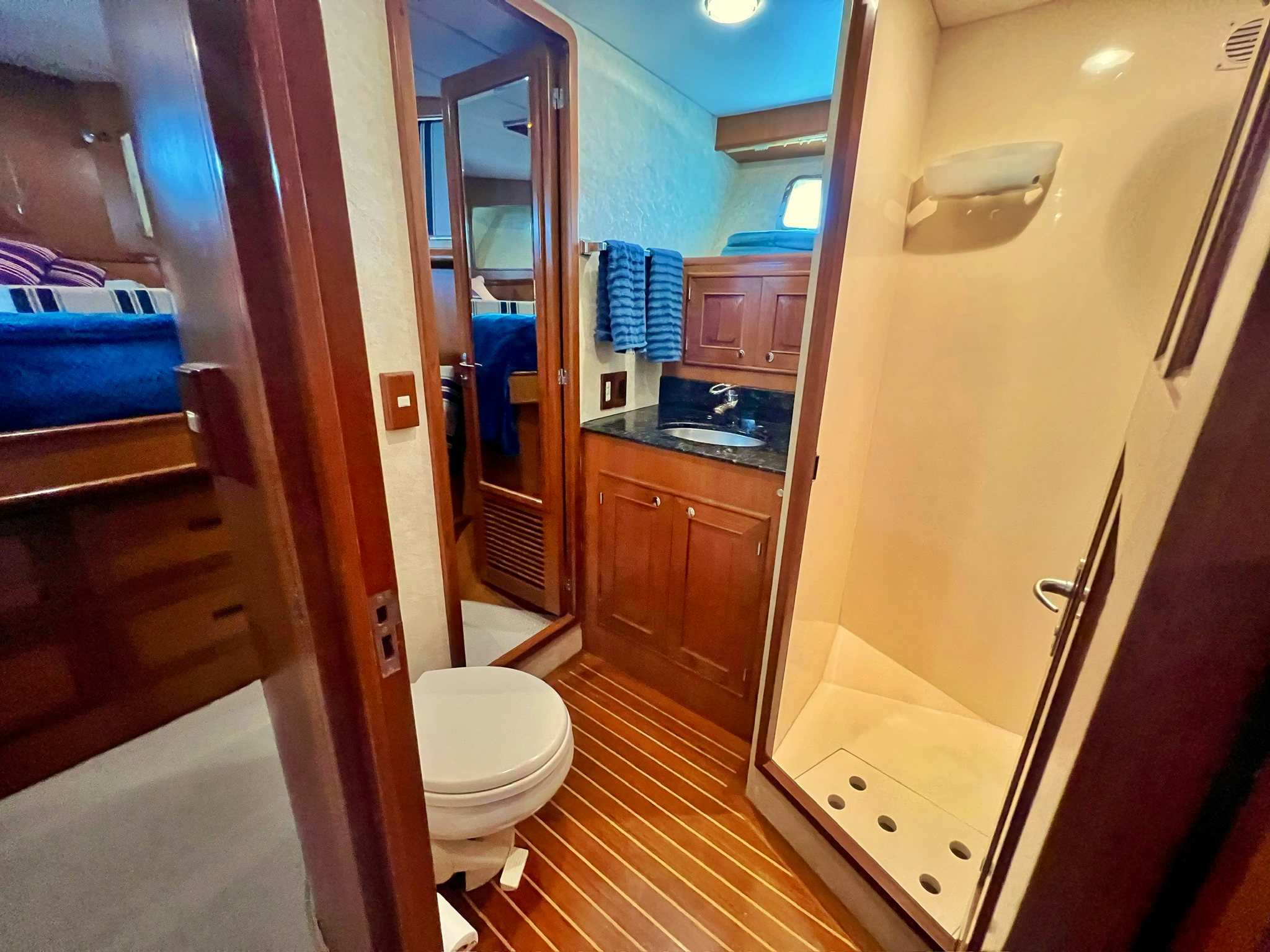 a bathroom with a sink and a toilet aboard SYNERGY Yacht for Sale