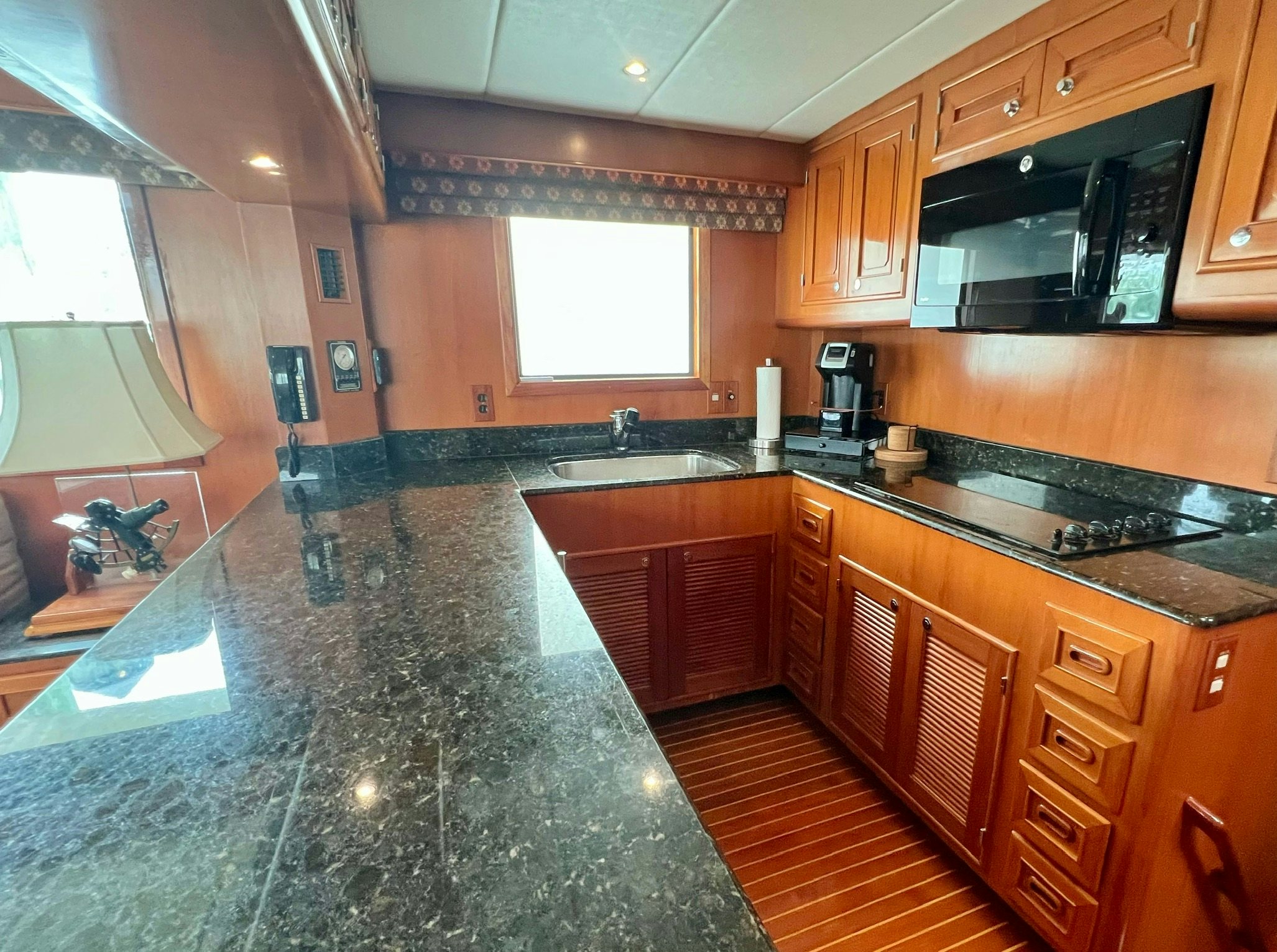 a kitchen with a large island aboard SYNERGY Yacht for Sale