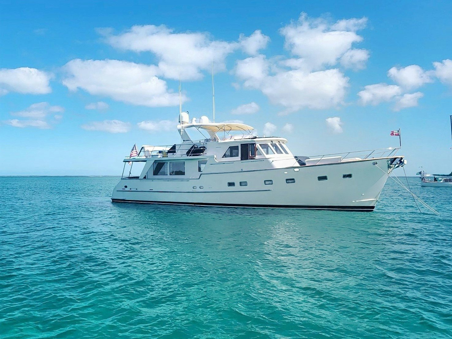 a white boat in the water aboard SYNERGY Yacht for Sale