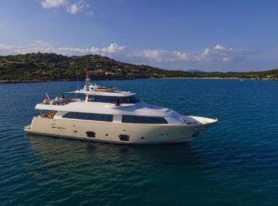 a white yacht in the water aboard ALL WE NEED FOR TODAY Yacht for Sale