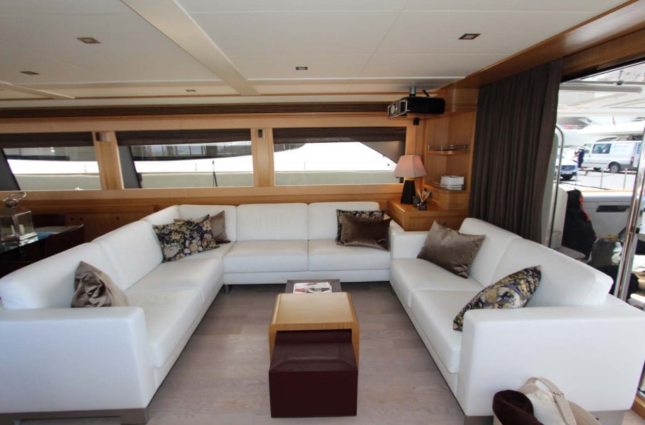 a living room with a white couch aboard ALL WE NEED FOR TODAY Yacht for Sale