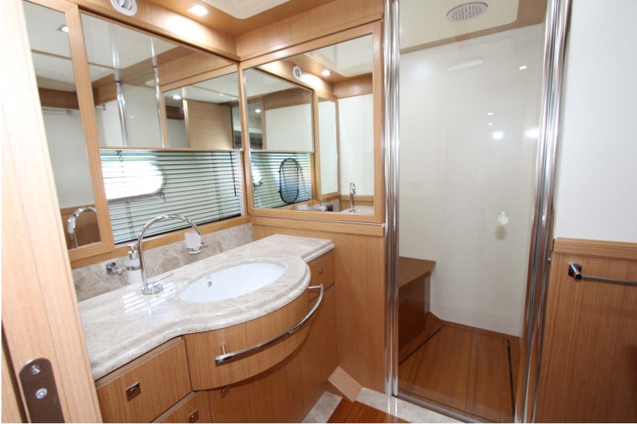 a bathroom with a sink and a mirror aboard ALL WE NEED FOR TODAY Yacht for Sale