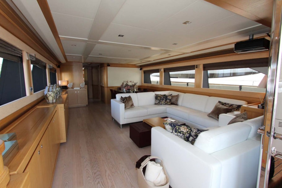 a living room with a large window aboard ALL WE NEED FOR TODAY Yacht for Sale