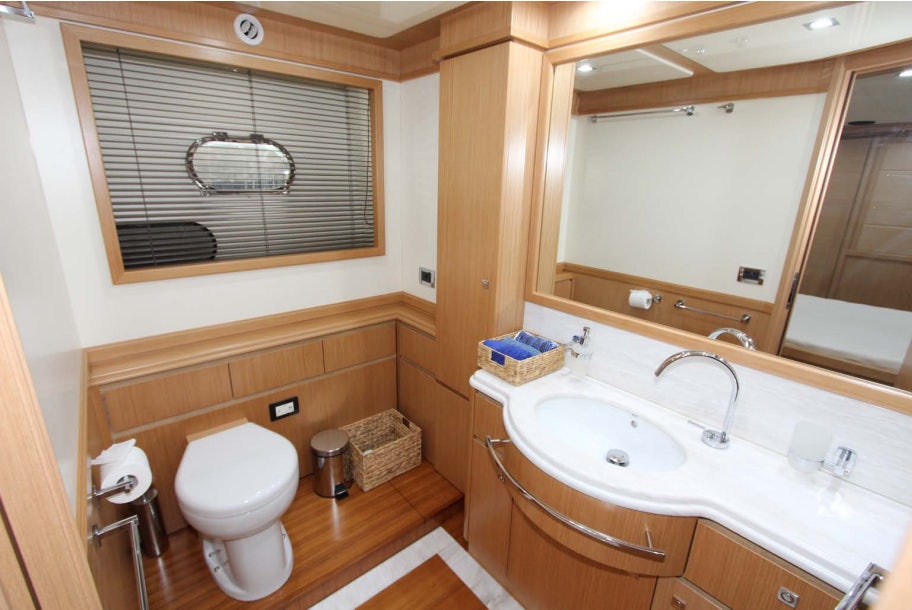 a bathroom with a toilet sink and a bathtub aboard ALL WE NEED FOR TODAY Yacht for Sale